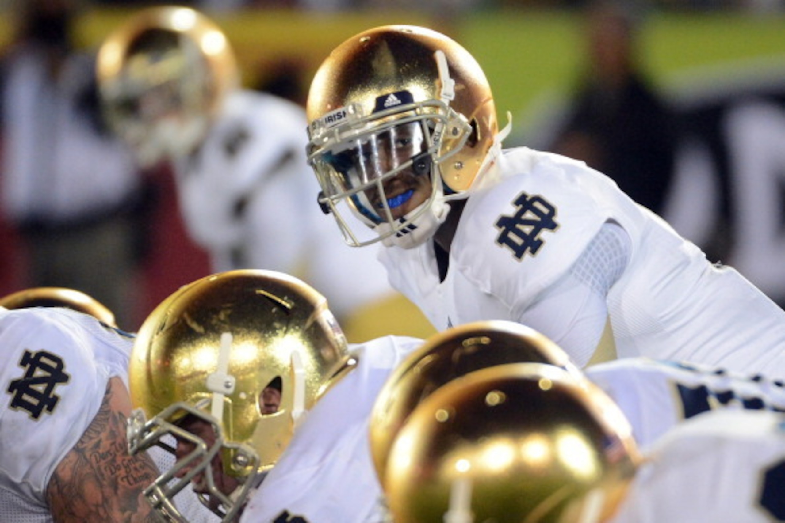 LOS ANGELES, CA - NOVEMBER 24:  Everett Golson #5 of the Notre Dame Fighting Irish lines up over center during a 22-13 win over the USC Trojans at Los Angeles Memorial Coliseum on November 24, 2012 in Los Angeles, California.  (Photo by Harry How/Getty Im