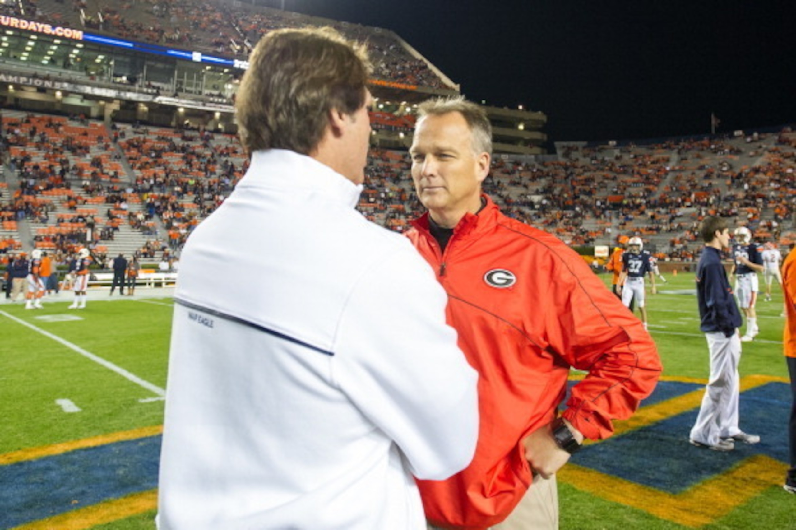 AUBURN, AL - NOVEMBER 10:  Coach Mark Richt of the Georgia Bulldogs chats with defensive coordinator Brian VanGorder of the Auburn Tigers before their game on November 10, 2012 at Jordan-Hare Stadium in Auburn, Alabama. Georgia defeated Auburn 38-0 and cl