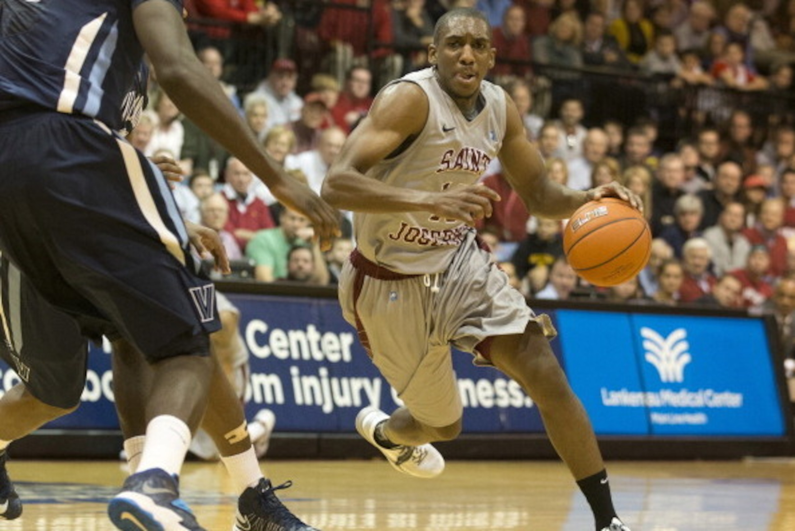 PHILADELPHIA, PA - DECEMBER 7: Guard Langston Galloway #10 of the St. Joseph's Hawks drives to the basket against the VIllanova Wildcats on December 7, 2013 at Hagan Arena in Philadelphia, Pennsylvania. (Photo by Mitchell Leff/Getty Images)