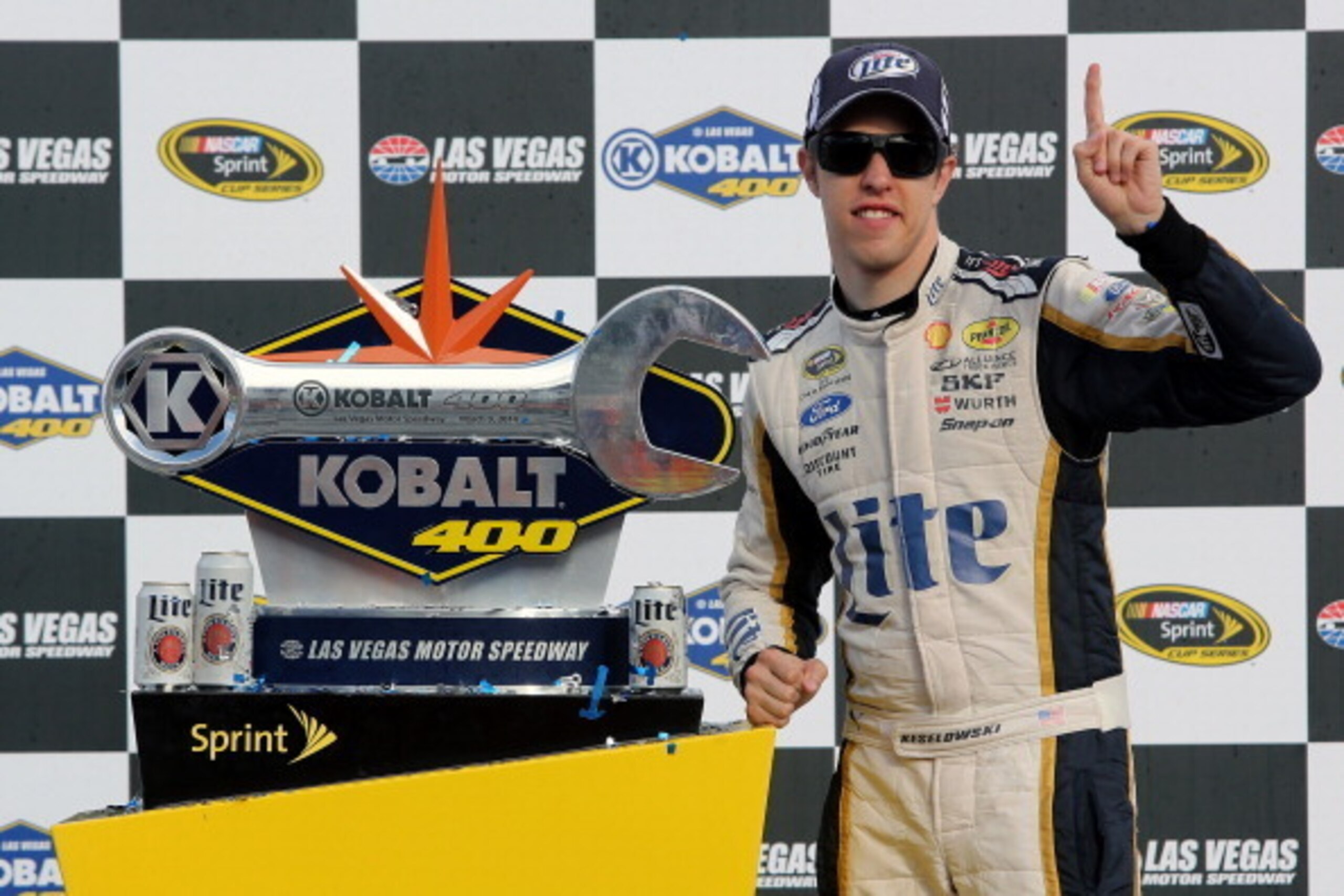 LAS VEGAS, NV - MARCH 09:  Brad Keselowski, driver of the #2 Miller Lite Ford, poses with the trophy after winning the NASCAR Sprint Cup Series Kobalt 400 at Las Vegas Motor Speedway on March 9, 2014 in Las Vegas, Nevada.  (Photo by Jerry Markland/Getty I