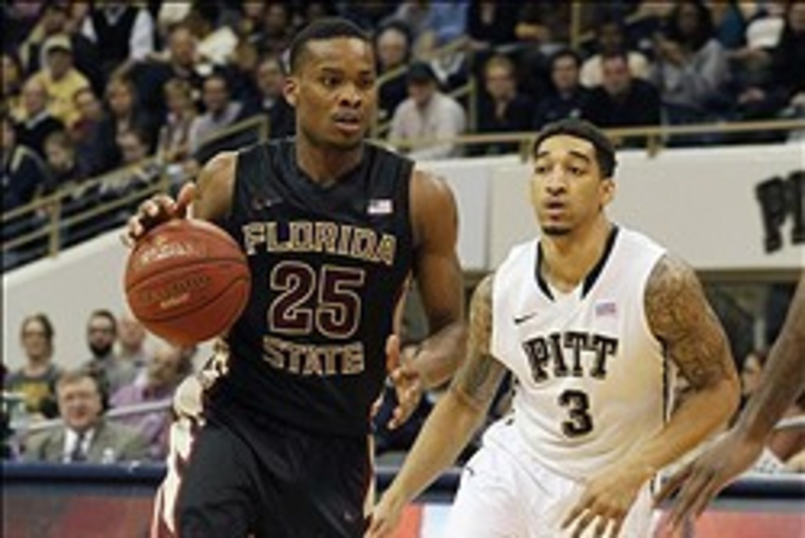 Feb 23, 2014; Pittsburgh, PA, USA; Florida State Seminoles guard Aaron Thomas (25) handles the ball against Pittsburgh Panthers guard Cameron Wright (3) during the second half at the Petersen Events Center. The Florida State Seminoles won 71-66. Mandatory
