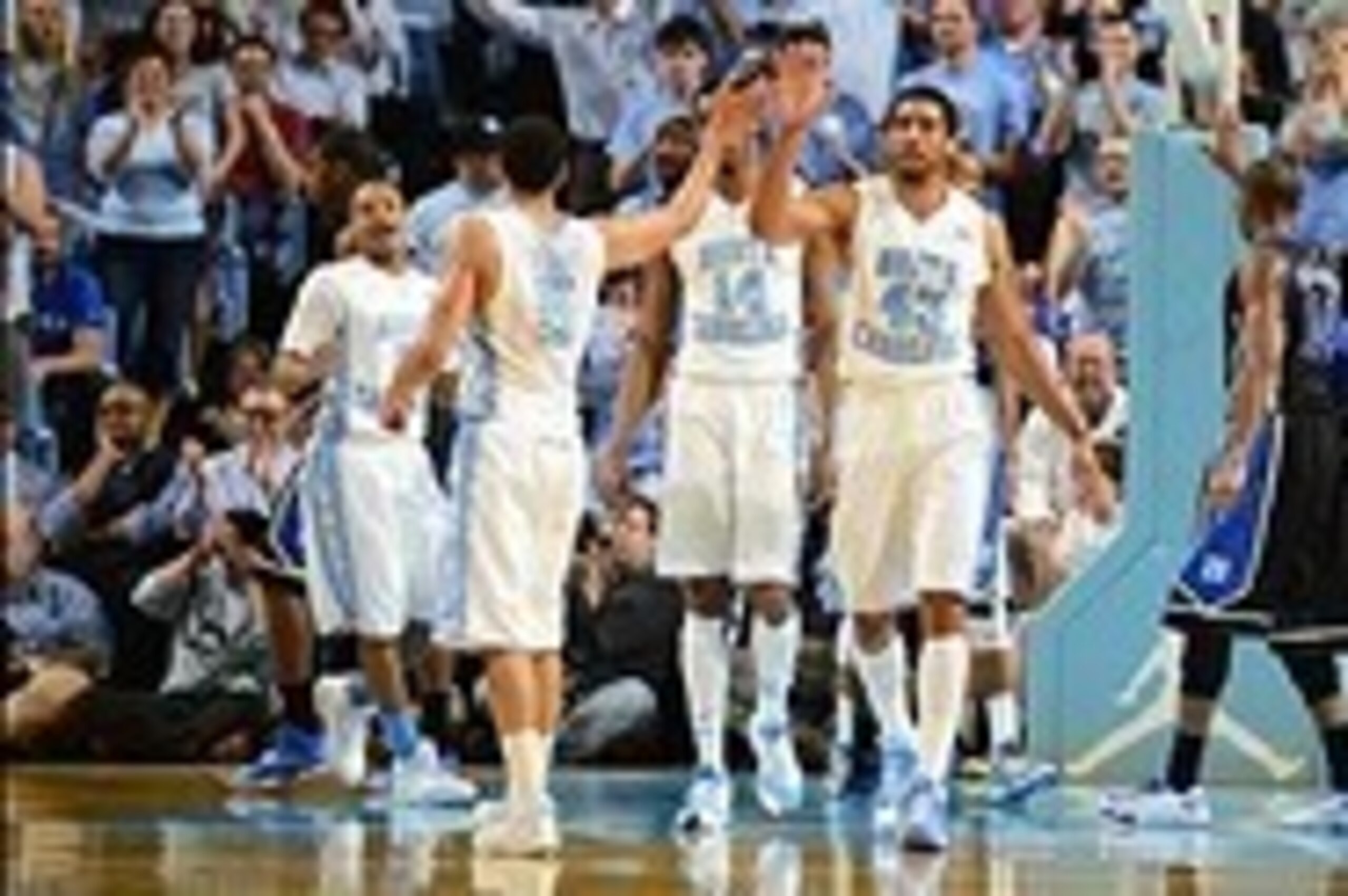 Feb 20, 2014; Chapel Hill, NC, USA; North Carolina Tar Heels guard Marcus Paige (5) and forward James Michael McAdoo (43) react in the first half at Dean E. Smith Center. Mandatory Credit: Bob Donnan-USA TODAY Sports