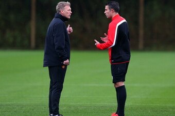 MANCHESTER, ENGLAND - OCTOBER 22:  David Moyes the manager of Manchester United talks with Robin Van Persie prior to a training session at Aon Training Complex on October 22, 2013 in Manchester, England.  (Photo by Alex Livesey/Getty Images)