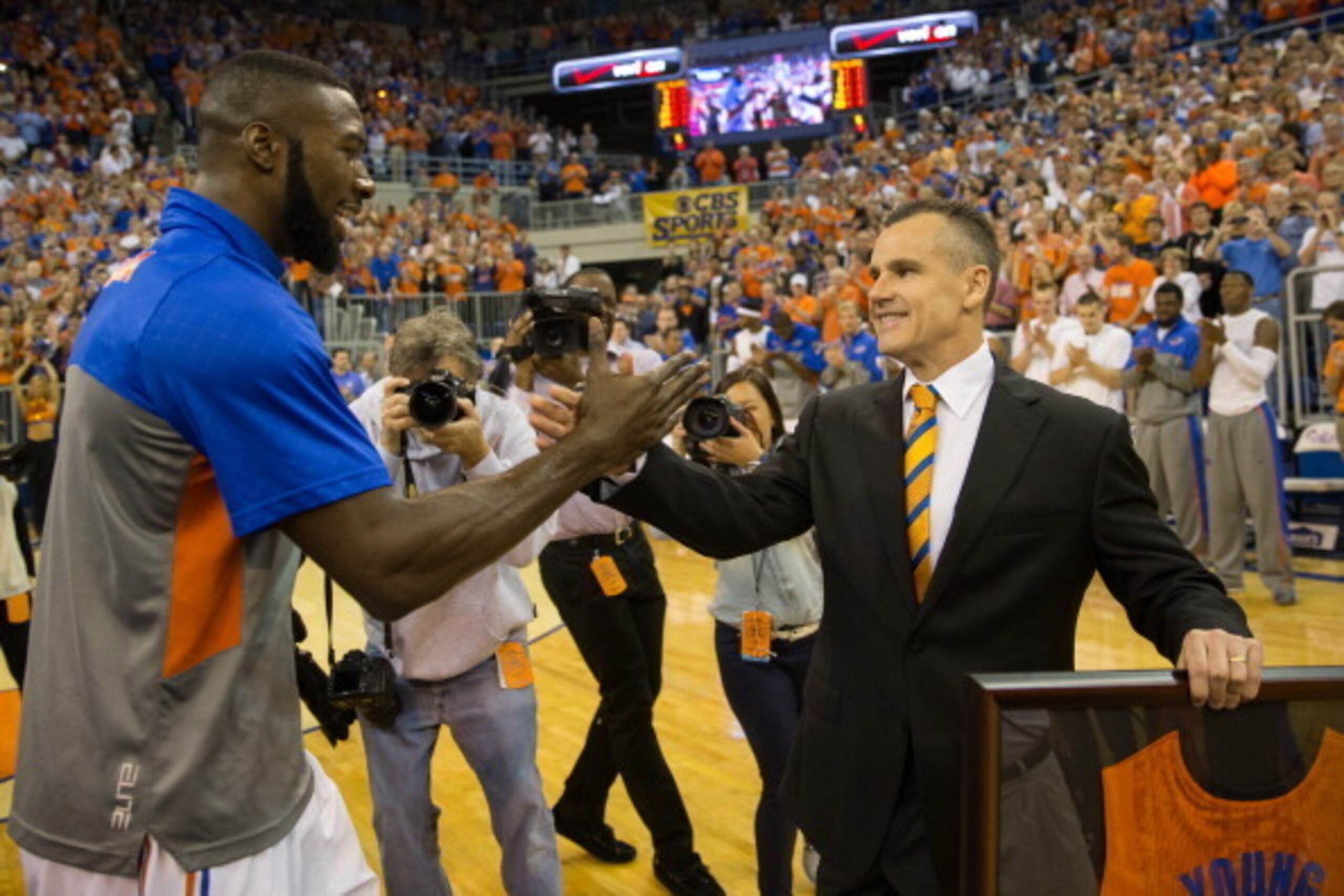GAINESVILLE, FL - MARCH 08: Patric Young #4 shakes hands with head coach Billy Donovan of the Florida Gators while being honored before the game against the Kentucky Wildcats at the Stephen C. O'Connell Center on March 8, 2014 in Gainesville, Florida. (Ph