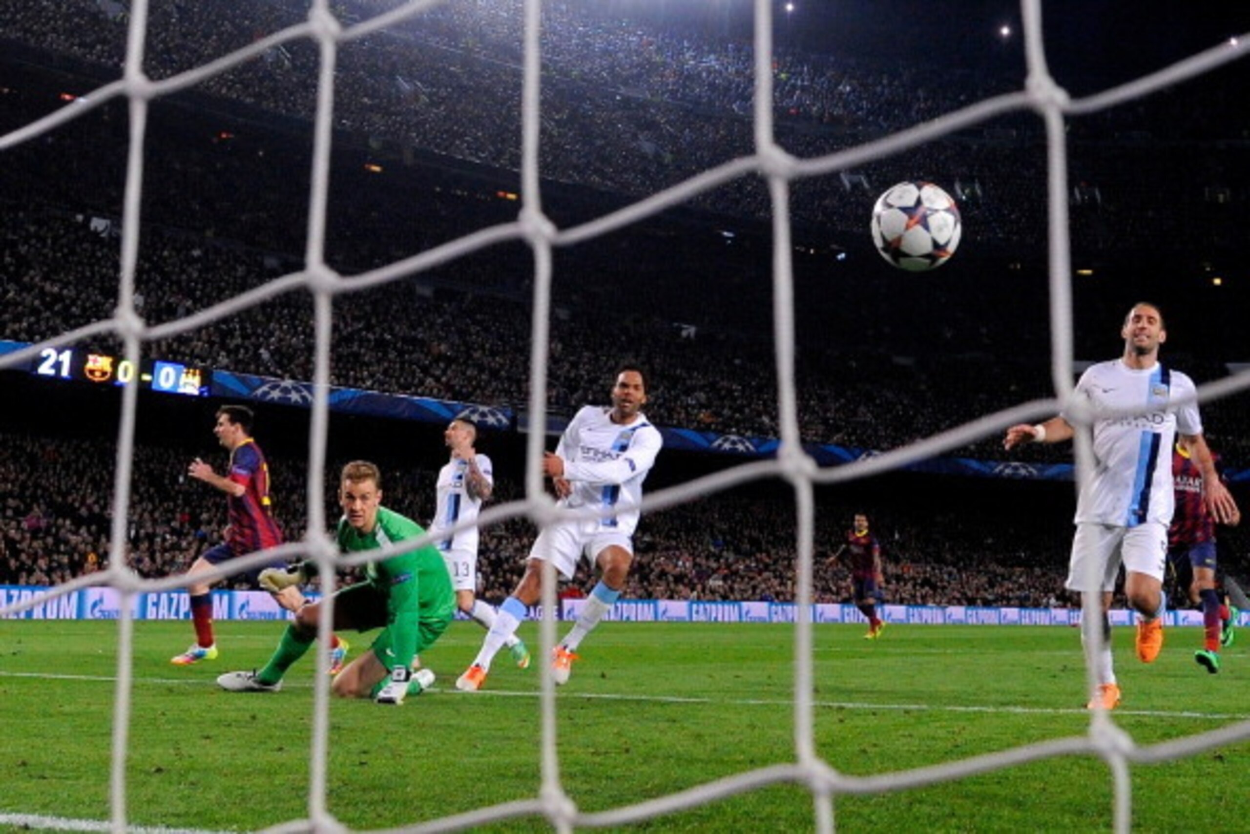BARCELONA, SPAIN - MARCH 12:  Lionel Messi (L) of Barcelona turns away to celebrate after scoring his team's opening goal during the UEFA Champions League Round of 16, second leg match between FC Barcelona and Manchester City  at Camp Nou on March 12, 201