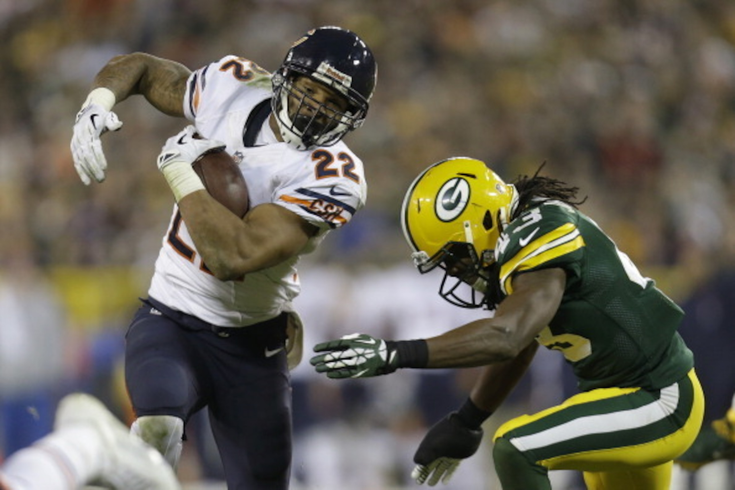 GREEN BAY, WI - NOVEMBER 04: Matt Forte #22 of the Chicago Bears runs with the football before getting tackled by M.D. Jennings #43 of the Green Bay Packers during the second half of play at Lambeau Field on November 04, 2013 in Green Bay, Wisconsin. (Pho