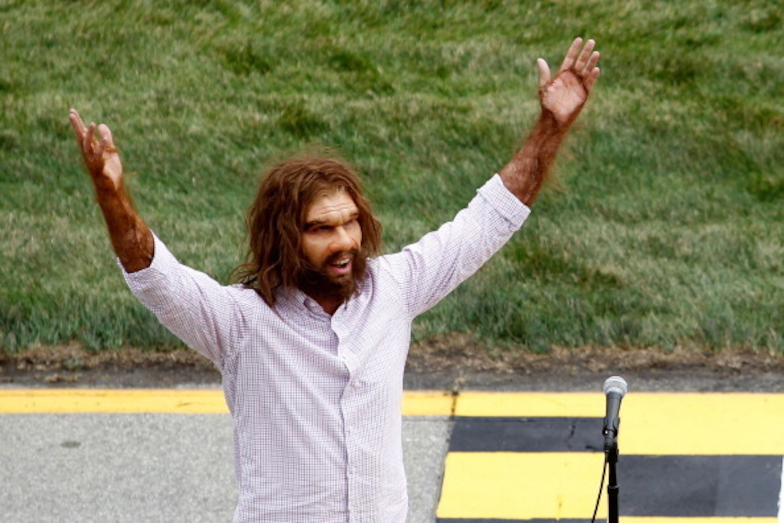 JOLIET, IL - SEPTEMBER 19:  The Geico Caveman gives the command, 'Gentlemen, start your engines' prior to the start of the NASCAR Sprint Cup Series GEICO 400 at Chicagoland Speedway on September 19, 2011 in Joliet, Illinois.  (Photo by Todd Warshaw/Getty 