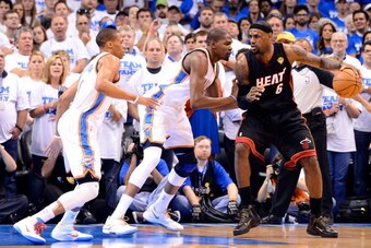 OKLAHOMA CITY, OK - JUNE 14:  LeBron James #6 of the Miami Heat posts up Kevin Durant #35 of the Oklahoma City Thunder as Russell Westbrook #0 plays help defense in the first quarter in Game Two of the 2012 NBA Finals at Chesapeake Energy Arena on June 14