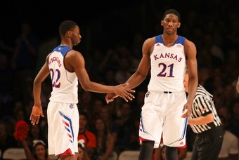 Nov 30, 2013; Paradise Island, BAHAMAS; Kansas Jayhawks guard Andrew Wiggins (22) and center Joel Embiid (21) react after a score during the game against the UTEP Miners at the 2013 Battle 4 Atlantis in the Imperial Arena at the Atlantis Resort. Mandatory