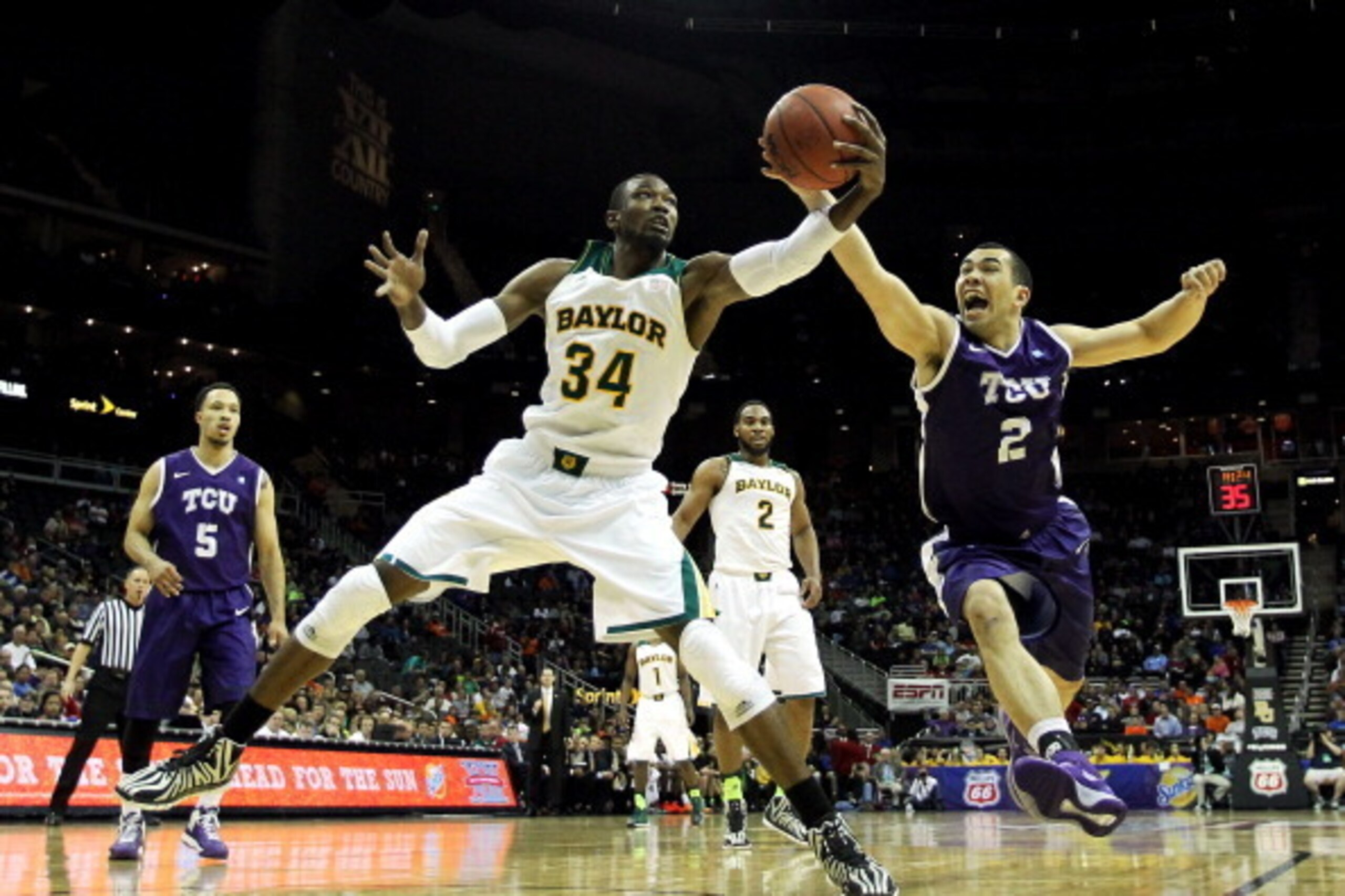 KANSAS CITY, MO - MARCH 12:  Cory Jefferson #34 of the Baylor Bears and Michael Williams #2 of the TCU Horned Frogs vie for a loose ball during the Big 12 Basketball Tournament first round game at the Sprint Center on March 12, 2014 in Kansas City, Missou