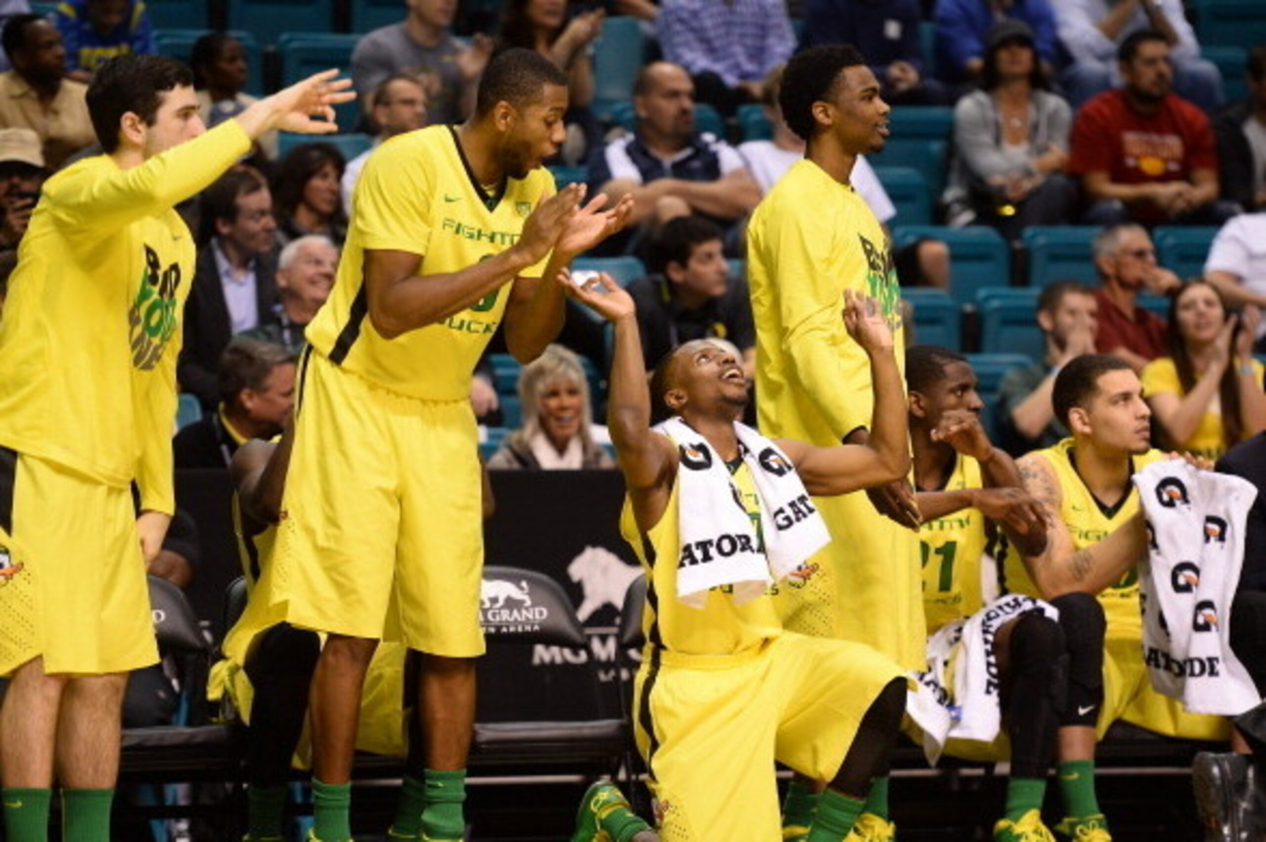 LAS VEGAS, NV - MARCH 12: Oregon Ducks players including Johnathan Loyd #10 (on ground) react late in their first-round game of the Pac-12 Basketball Tournament against the Oregon State Beavers at the MGM Grand Garden Arena on March 12, 2014 in Las Vegas LAS VEGAS, NV - MARCH 12: Oregon Ducks players including Johnathan Loyd #10 (on ground) react late in their first-round game of the Pac-12 Basketball Tournament against the Oregon State Beavers at the MGM Grand Garden Arena on March 12, 2014 in Las Vegas