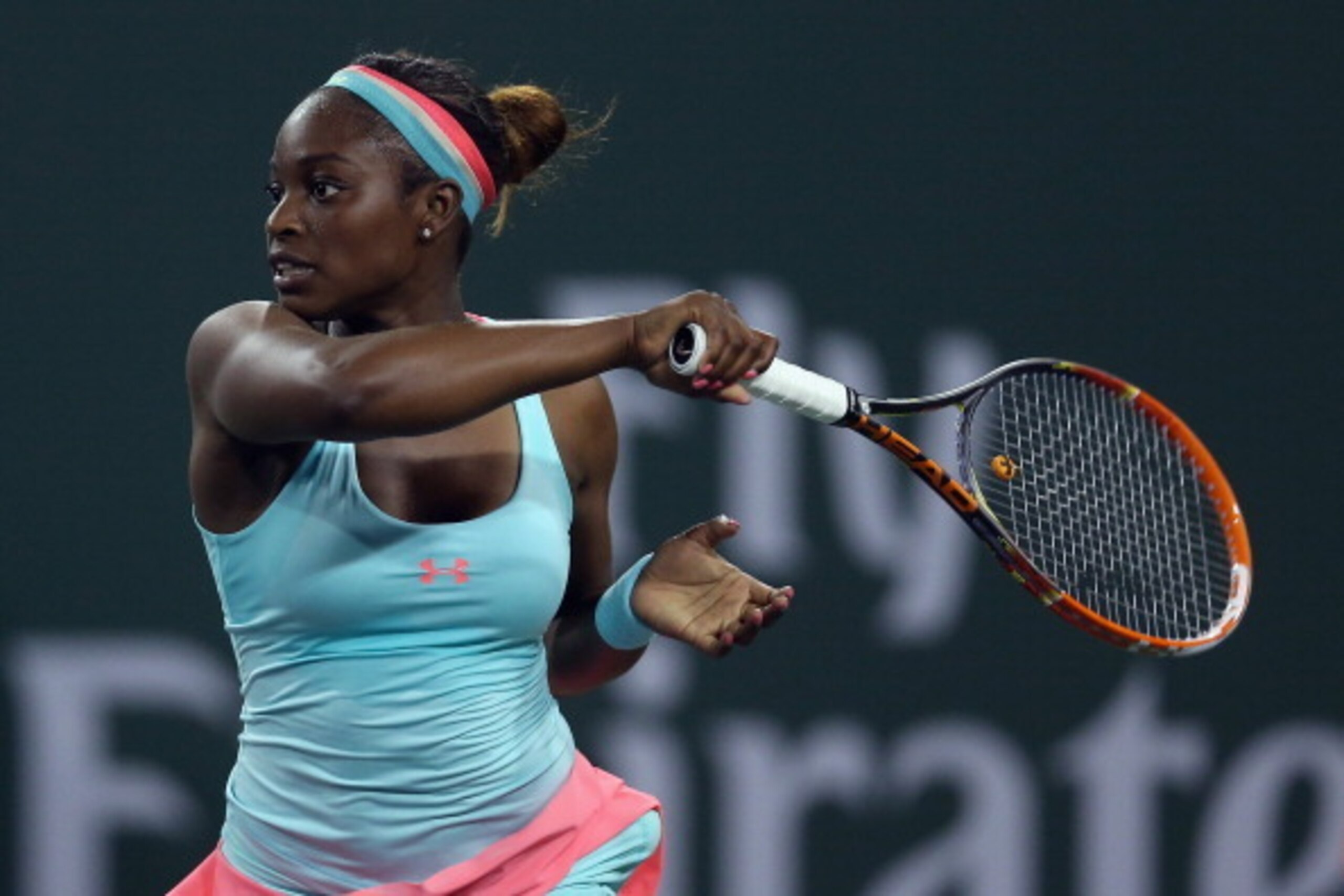INDIAN WELLS, CA - MARCH 10:  Sloane Stephens follows through on a forehand to Ana Ivanovic of Serbia during the BNP Paribas Open at Indian Wells Tennis Garden on March 10, 2014 in Indian Wells, California.  (Photo by Jeff Gross/Getty Images)