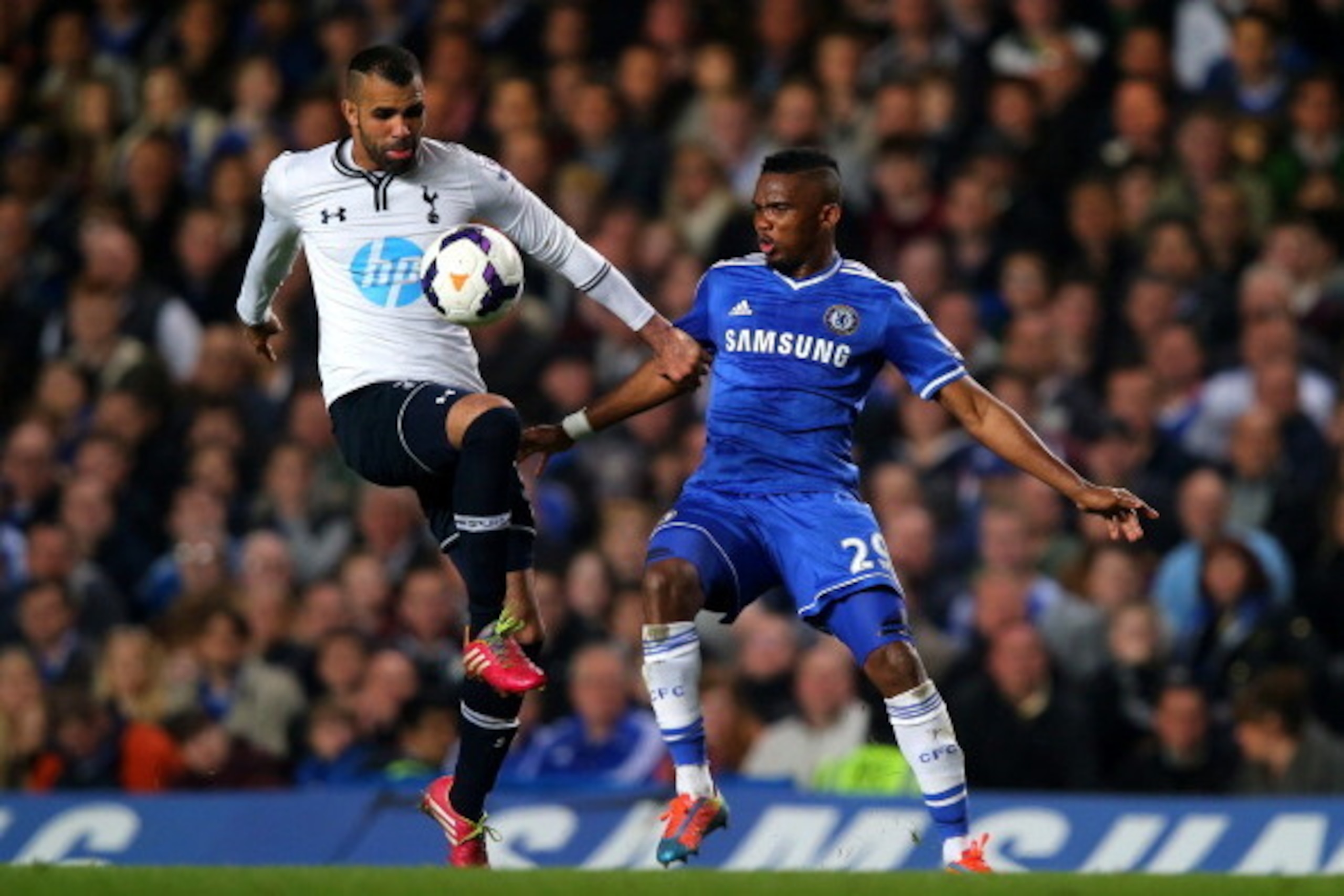 LONDON, ENGLAND - MARCH 08:  Sandro of Spurs and Samuel Eto'o of Chelsea compete for the ball during the Barclays Premier League match between Chelsea and Tottenham Hotspur at Stamford Bridge on March 8, 2014 in London, England.  (Photo by Clive Rose/Gett
