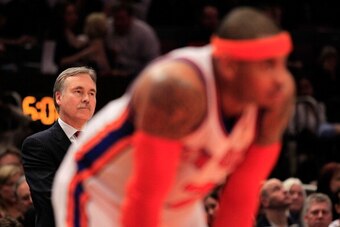 NEW YORK, NY - MARCH 30: Head coach Mike D'Antoni looks on over his player Carmelo Anthony #7 of the New York Knicks during the game against the New Jersey Nets at Madison Square Garden on March 30, 2011 in New York City. NOTE TO USER: User expressly ackn