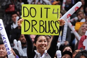 LOS ANGELES, CA - FEBRUARY 22: A fan holds up a sign in memory of late Los Angeles Lakers owner Dr. Jerry Buss during a game between the Portland Trail Blazers and the Lakers at Staples Center on February 22, 2013 in Los Angeles, California. NOTE TO USER: