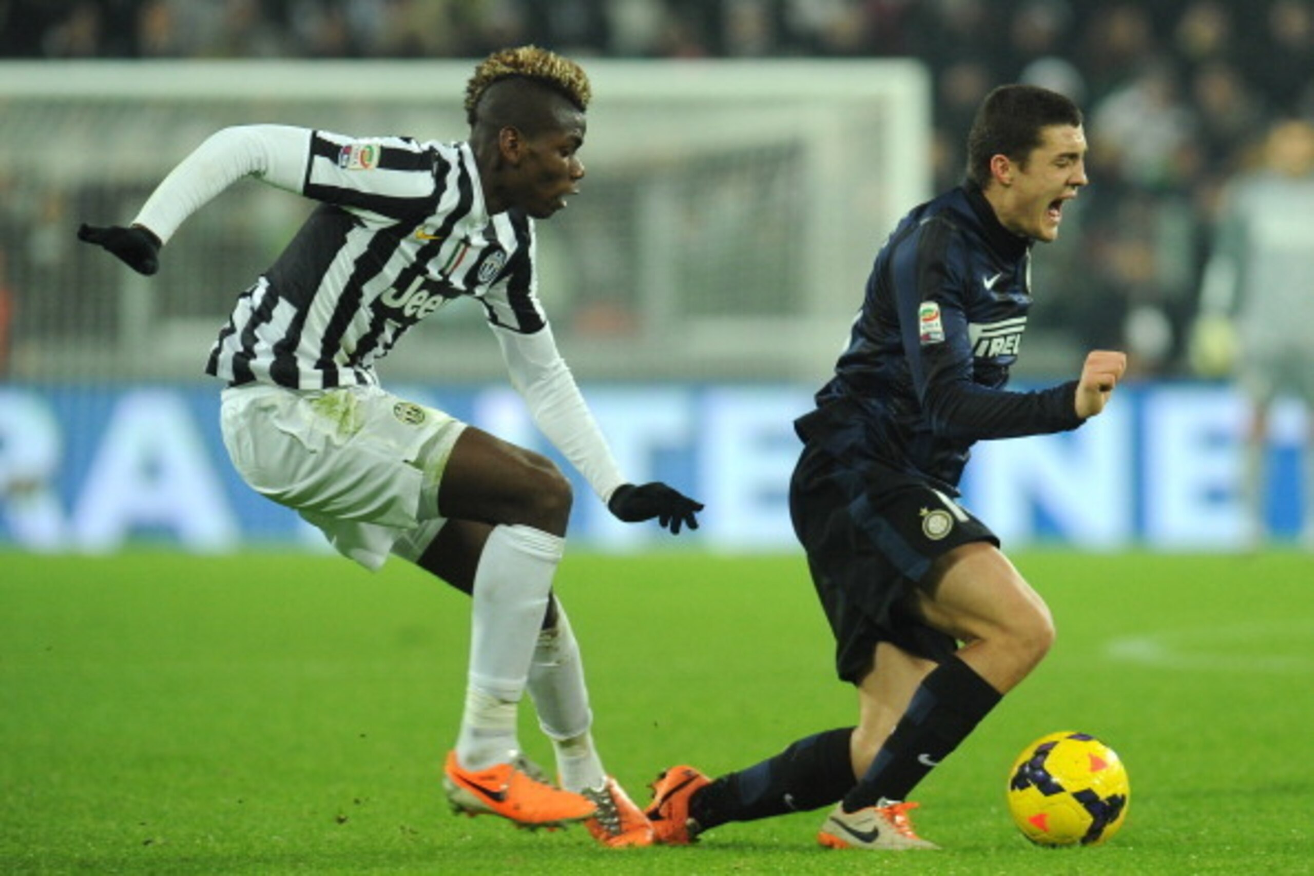 TURIN, ITALY - FEBRUARY 02:  Paul Pogba (L) of Juventus tackles Mateo Kovacic of FC Internazionale Milano during the Serie A match between Juventus and FC Internazionale Milano at Juventus Arena on February 2, 2014 in Turin, Italy.  (Photo by Valerio Penn
