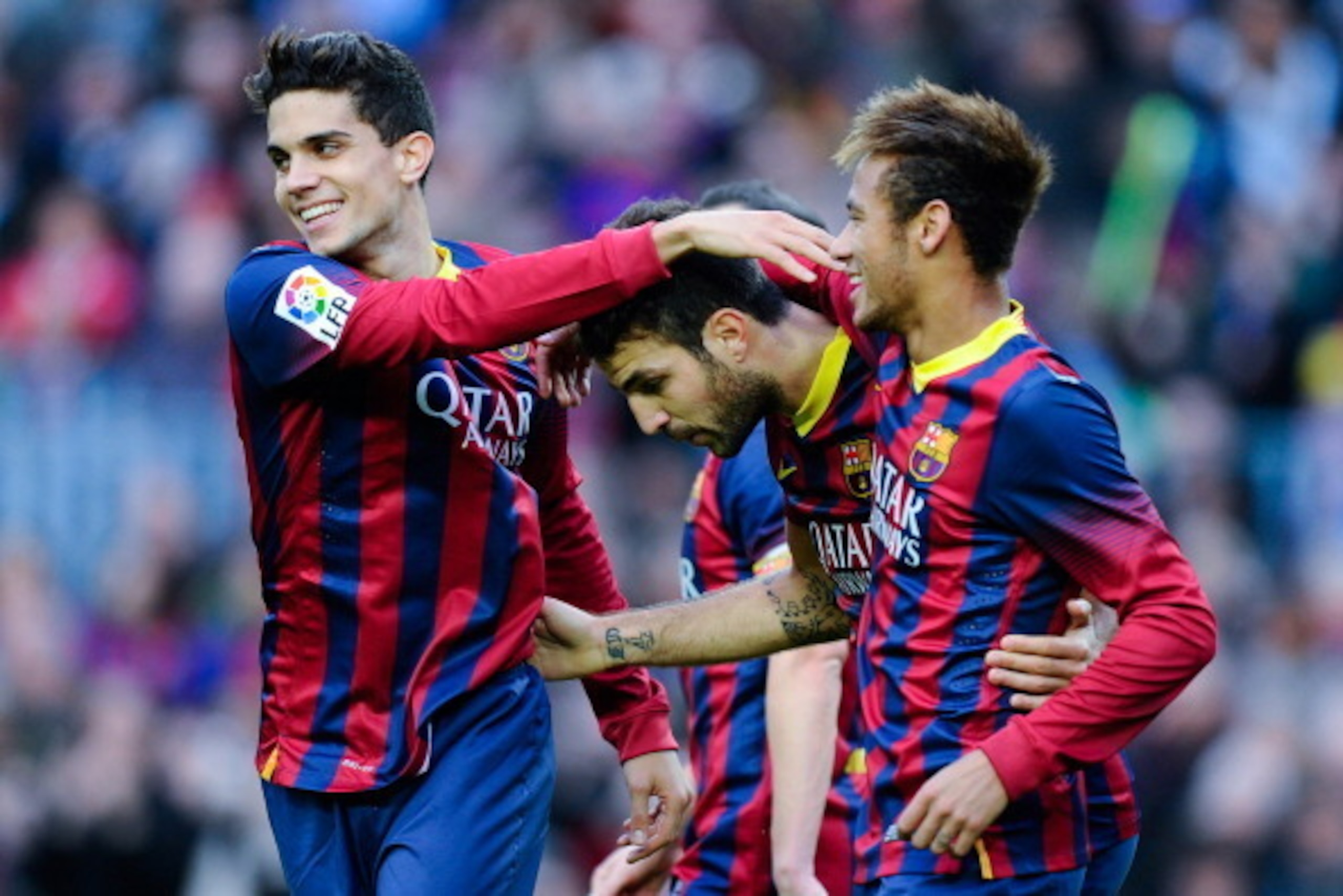 BARCELONA, SPAIN - NOVEMBER 23:  Cesc Fabregas (C) of FC Barcelona celebrates with his teammates Marc Bartra (L) and Neymar after scoring his team's second goal from the penalty spot during the La Liga match between FC Barcelona and Granda CF at Camp Nou 