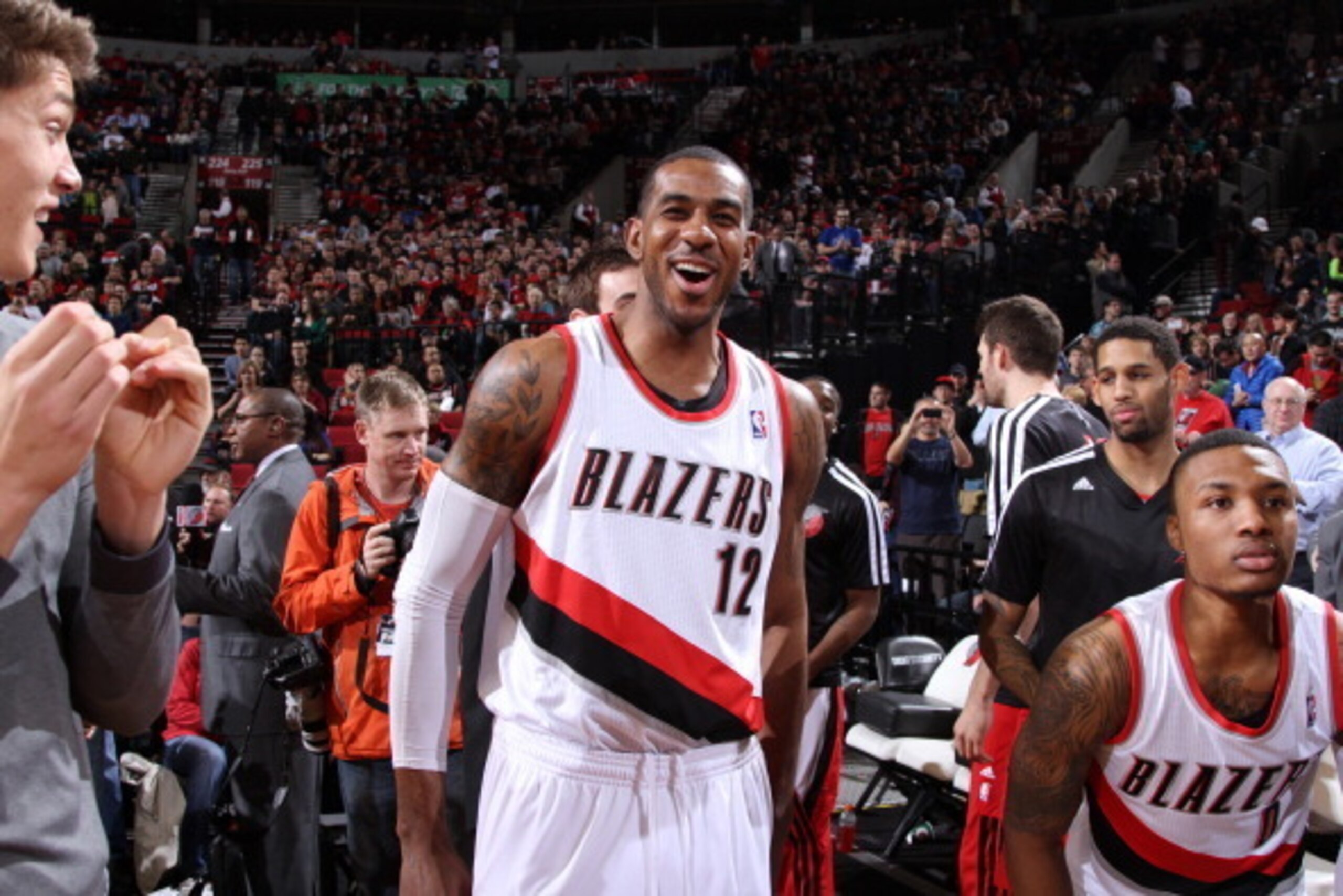 PORTLAND, OR - DECEMBER 21:  Damian Lillard #0 and LaMarcus Aldridge #12 of the Portland Trail Blazers smile after the game against the New Orleans Pelicans on December 21, 2013 at the Moda Center Arena in Portland, Oregon. NOTE TO USER: User expressly ac