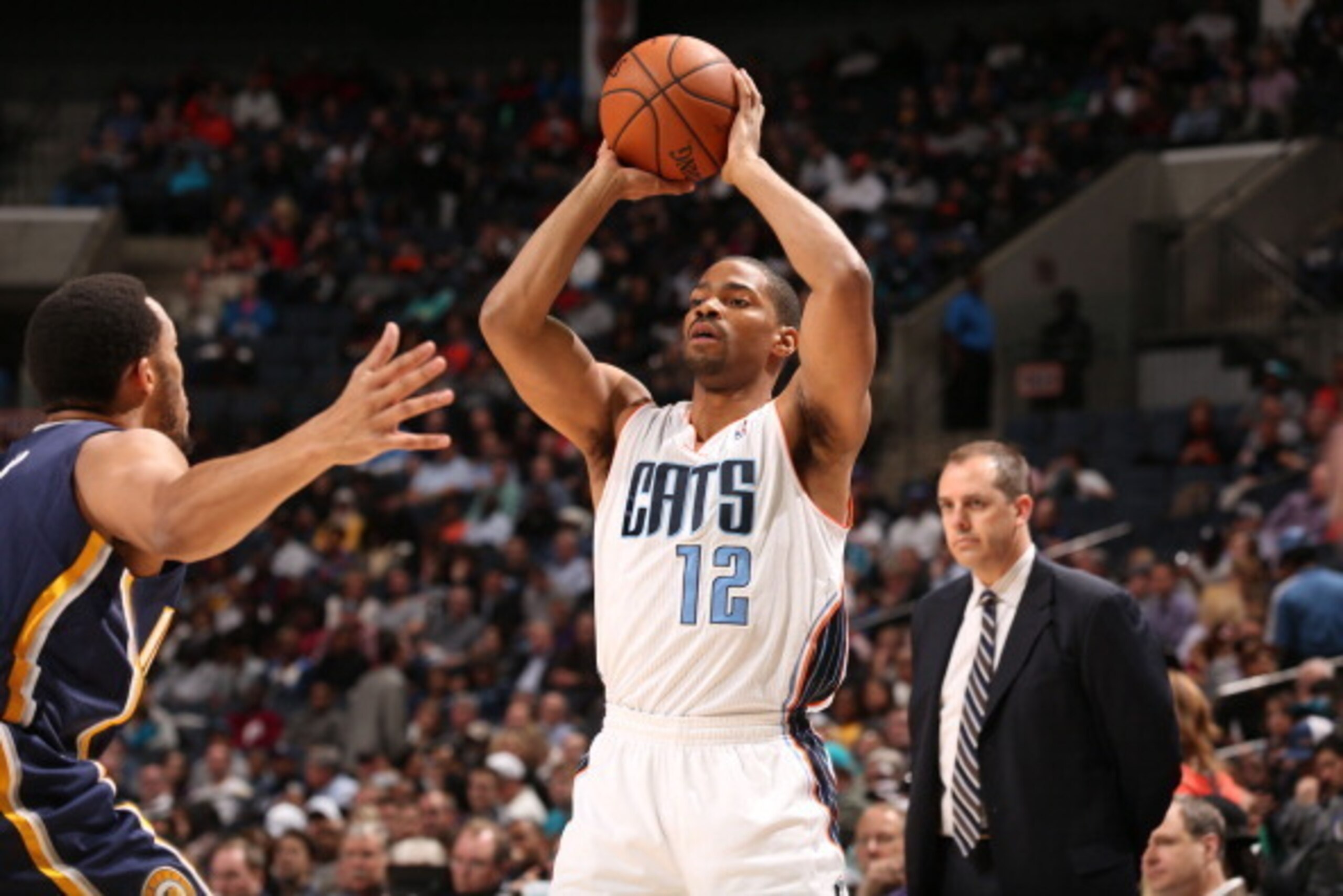 CHARLOTTE, NC - MARCH 5:  Gary Neal #12 of the Charlotte Bobcats shoots against the Indiana Pacers during the game at the Time Warner Cable Arena on March 5, 2014 in Charlotte, North Carolina. NOTE TO USER: User expressly acknowledges and agrees that, by 