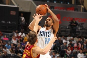 CHARLOTTE, NC - MARCH 7:  Gary Neal #12 of the Charlotte Bobcats shoots against Matthew Dellavedova #8 of the Cleveland Cavaliers during the game at the Time Warner Cable Arena on March 7, 2014 in Charlotte, North Carolina. NOTE TO USER: User expressly ac