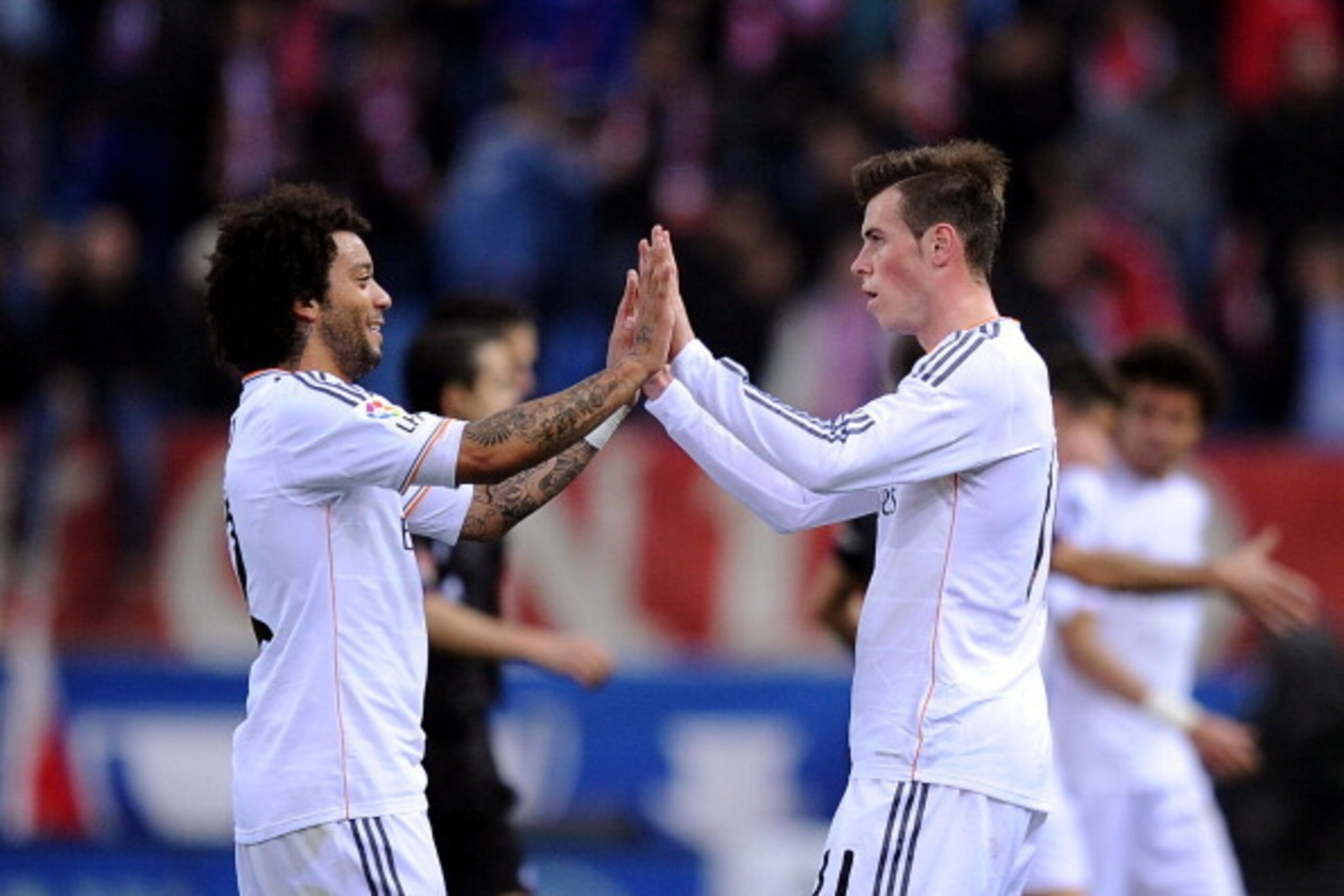 MADRID, SPAIN - MARCH 02:  Marcelo (L) and Gareth Bale of Real Madrid CF celebrate after Real drew 2-2 against Club Atletico de Madrid during the La Liga match between Club Atletico de Madrid and Real Madrid CF  at Vicente Calderon Stadium on March 2, 201