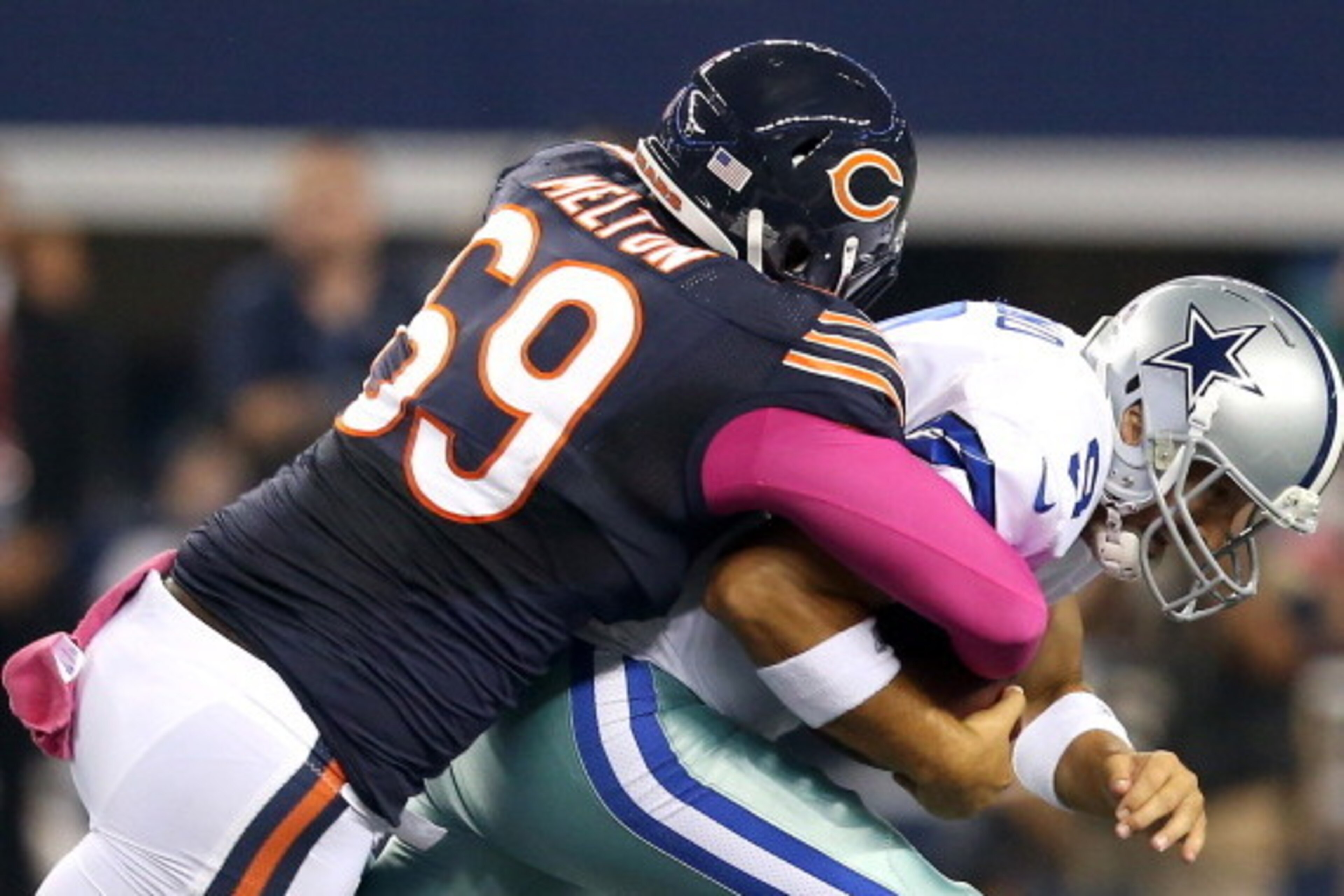 ARLINGTON, TX - OCTOBER 01:  Henry Melton #69 of the Chicago Bears sacks quarterback Tony Romo #9 of the Dallas Cowboys in the first quarter at Cowboys Stadium on October 1, 2012 in Arlington, Texas.  (Photo by Ronald Martinez/Getty Images)
