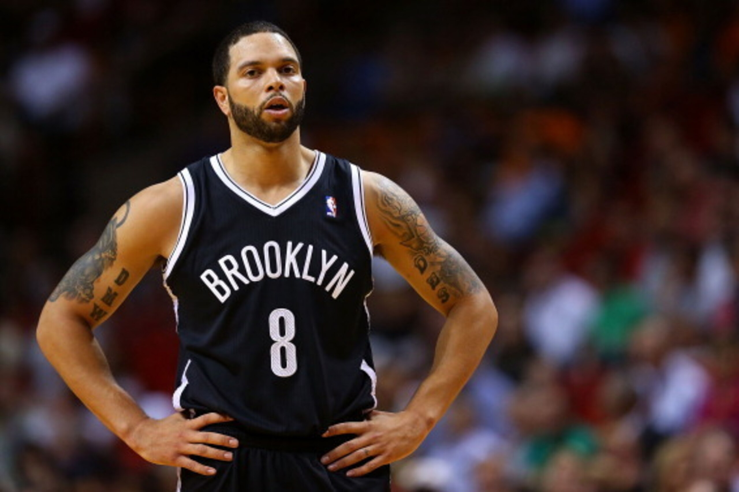 MIAMI, FL - MARCH 12: Deron Williams #8 of the Brooklyn Nets looks on during a game against the Miami Heat at American Airlines Arena on March 12, 2014 in Miami, Florida. NOTE TO USER: User expressly acknowledges and agrees that, by downloading and/or usi