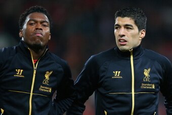 MANCHESTER, ENGLAND - SEPTEMBER 25:  Luis Suarez of Liverpool (r) looks on prior to the Capital One Cup Third Round match betwen Manchester United and Liverpool at Old Trafford on September 25, 2013 in Manchester, England.  (Photo by Julian Finney/Getty I