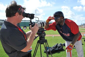 Feb 21, 2014; Ft Myers, FL, USA; Boston Red Sox designated hitter David Ortiz (34) jokes around with a videographer before batting practice during spring training at JetBlue Park. Mandatory Credit: Steve Mitchell-USA TODAY Sports