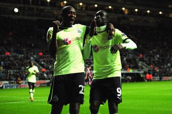 NEWCASTLE UPON TYNE, ENGLAND - OCTOBER 04:  Newcastle player Papiss Cisse (right) and Shola Ameobi celebrate the third Newcastle goal during the UEFA Europa League  match between Newcastle United and FC Girondins de Bordeaux at Sports Direct Arena on Octo