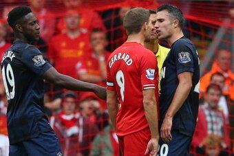 LIVERPOOL, ENGLAND - SEPTEMBER 01:  Steven Gerrard of Liverpool exchanges words with Robin van Persie of Manchester United during the Barclays Premier League match between Liverpool and Manchester United at Anfield on September 01, 2013 in Liverpool, Engl