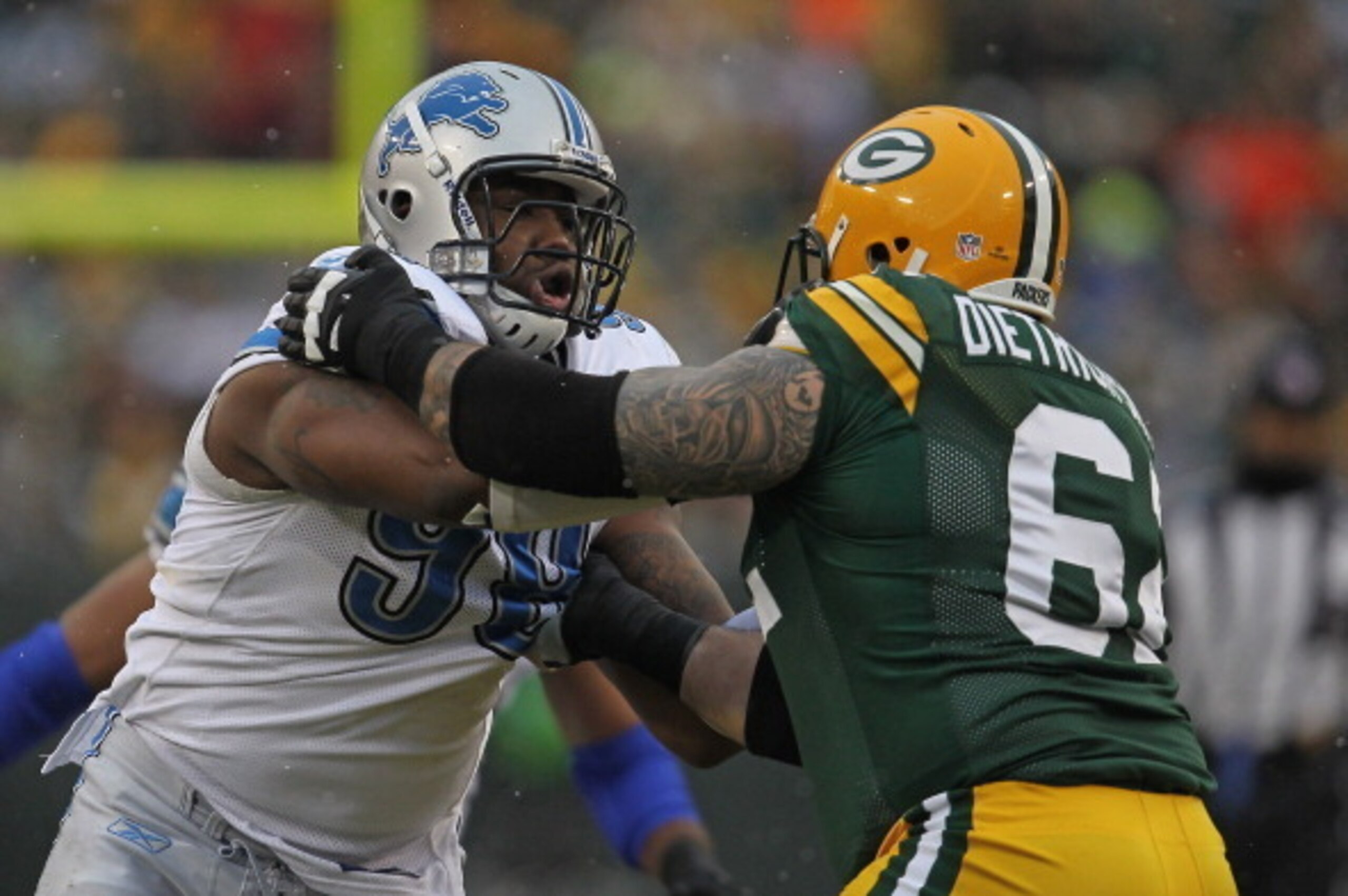 GREEN BAY, WI - JANUARY 01:  Nick Fairley #98 of the Detroit Lions rushes against Evan Dietrich-Smith #62 of the Green Bay Packers at Lambeau Field on January 1, 2012 in Green Bay, Wisconsin. The Packers defeated the Lions 45-41.  (Photo by Jonathan Danie