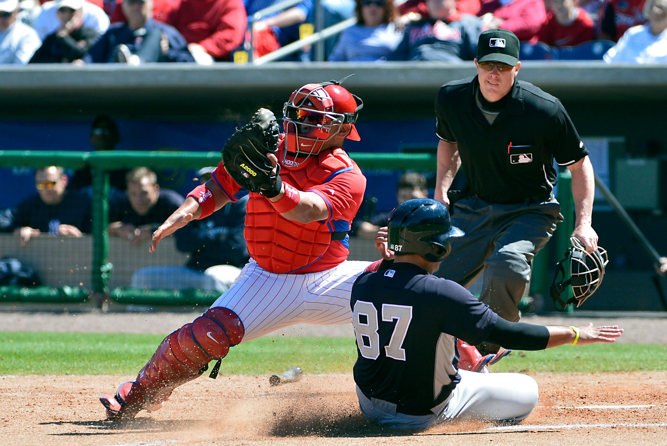 Mar 13, 2014; Clearwater, FL, USA; Philadelphia Phillies catcher Carlos Ruiz (51) tags New York Yankees catcher Francisco Arcia (87) out at the plate during the seventh inning at Bright House Field. Mandatory Credit: Tommy Gilligan-USA TODAY Sports