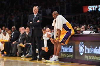 LOS ANGELES, CA - APRIL 5: Head Coach Mike D'Antoni of the Los Angeles Lakers and Kobe Bryant #24 look on from the sideline during a game against the Memphis Grizzlies at Staples Center on April 5, 2013 in Los Angeles, California. NOTE TO USER: User expre