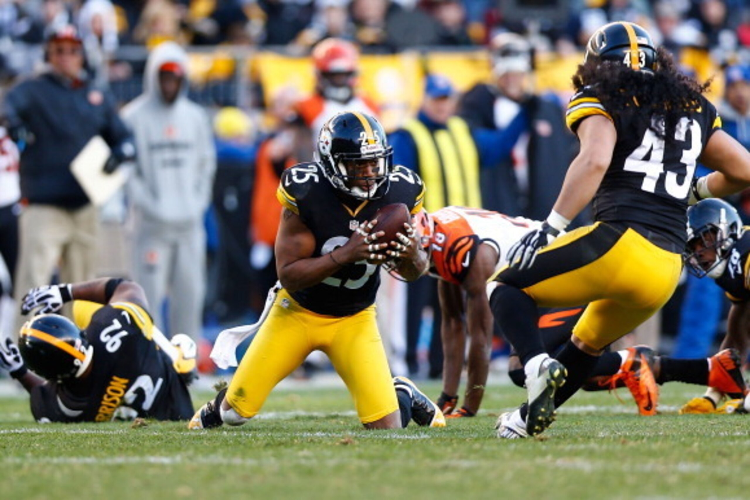 PITTSBURGH, PA - DECEMBER 23: Ryan Clark #25 of the Pittsburgh Steelers recovers a fumble by A.J. Green #18 of the Cincinnati Bengals during the game at Heinz Field on December 23, 2012 in Pittsburgh, Pennsylvania. (Photo by Jared Wickerham/Getty Images)