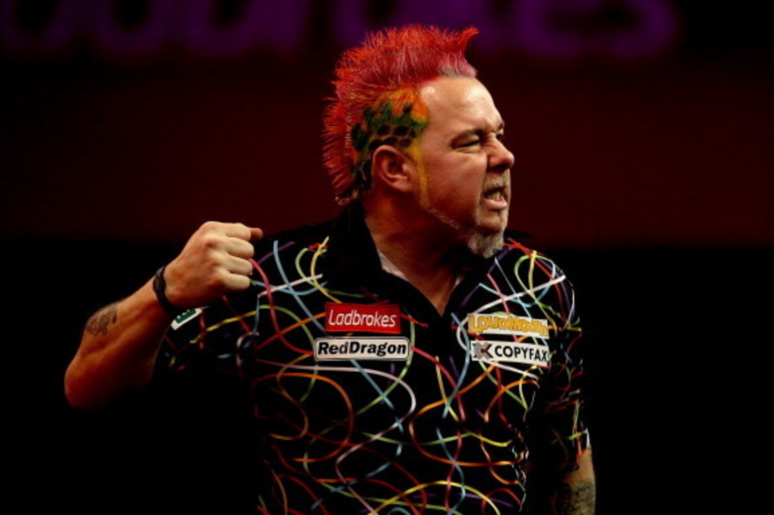 LONDON, ENGLAND - JANUARY 01:  Peter Wright of Scotland celebrates winning the fifth set during the final of the Ladbrokes.com World Darts Championships against Michael van Gerwen of The Netherlands at Alexandra Palace on January 1, 2014 in London, Englan