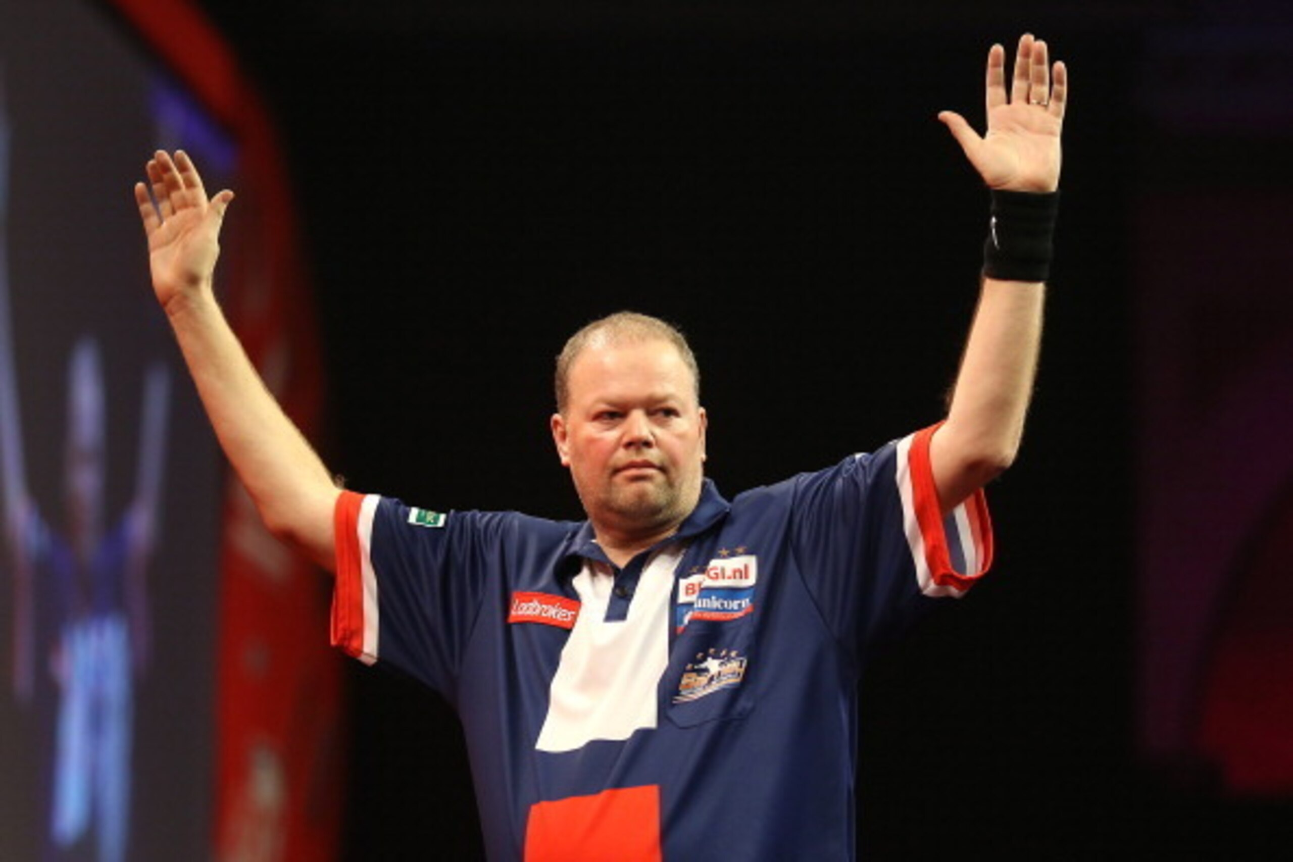 LONDON, ENGLAND - DECEMBER 20:  Raymond Van Barneveld of Holland celebrates after winning his second round match against Jamie Caven of England during the Ladbrokes.com World Darts Championship on Day Eight at Alexandra Palace on December 20, 2013 in Lond