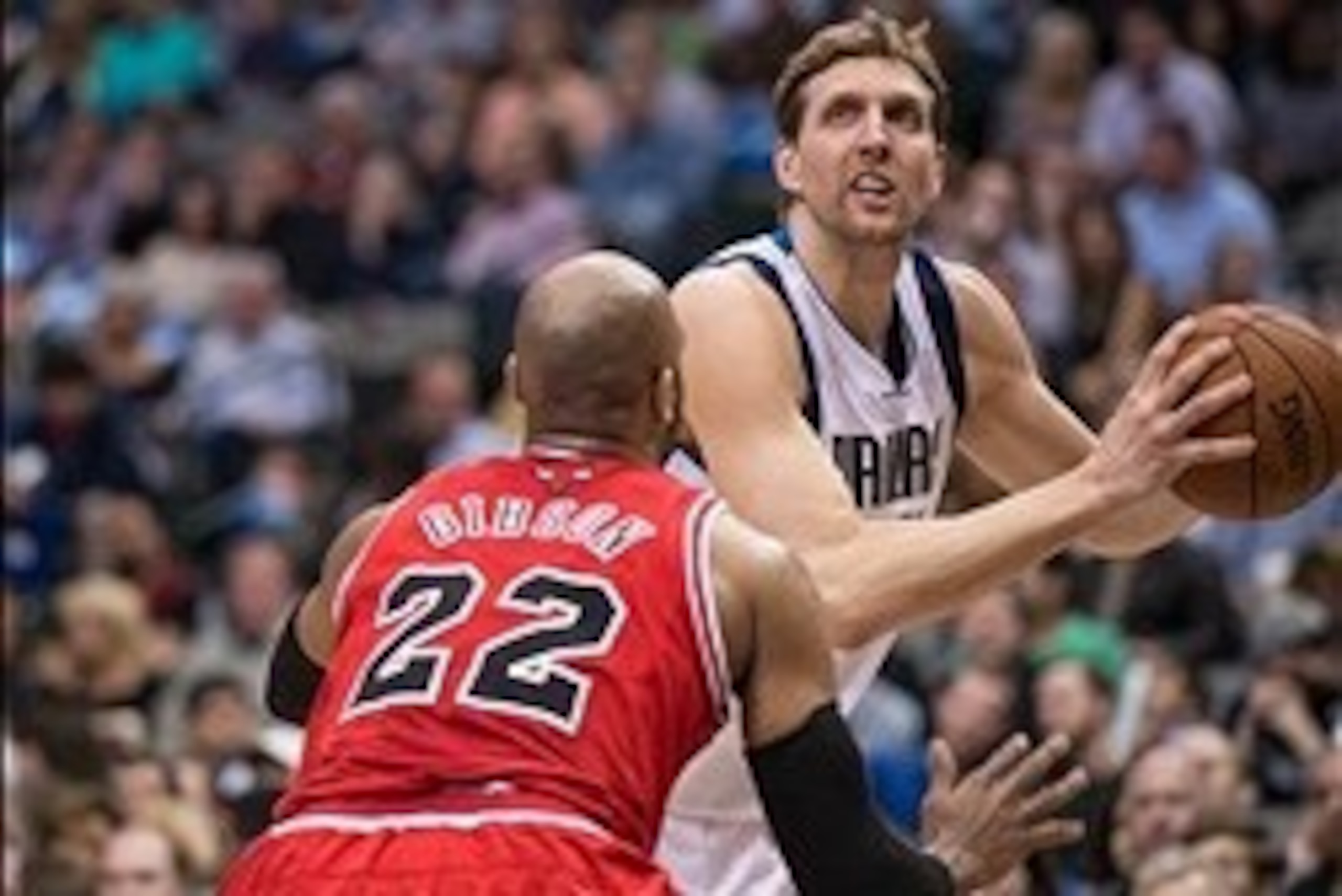 Feb 28, 2014; Dallas, TX, USA; Chicago Bulls power forward Taj Gibson (22) guards Dallas Mavericks power forward Dirk Nowitzki (41) during the first half at the American Airlines Center. Mandatory Credit: Jerome Miron-USA TODAY Sports