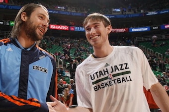 SALT LAKE CITY, UT - DECEMBER 30:  Gordon Hayward #20 of the Utah Jazz greets Josh McRoberts #11 of the Charlotte Bobcats prior to the game at EnergySolutions Arena on December 30, 2013 in Salt Lake City, Utah. NOTE TO USER: User expressly acknowledges an