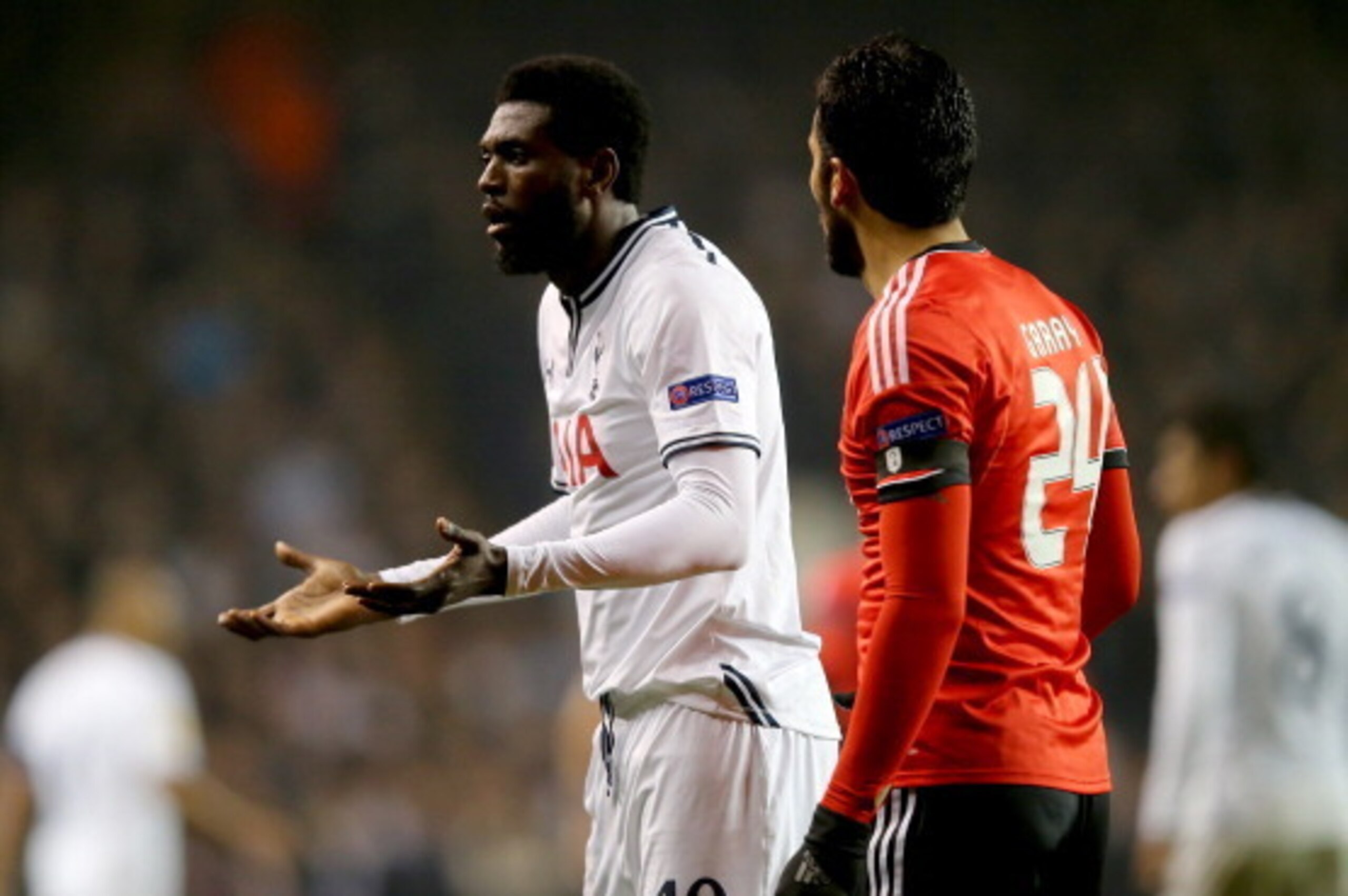 LONDON, ENGLAND - MARCH 13:  Emmanuel Adebayor of Tottenham Hotspur appeals as Ezequiel Garay of Benfica looks on during the UEFA Europa League Round of 16 first leg match between Tottenham Hotspur FC and SL Benfica at White Hart Lane on March 13, 2014 in