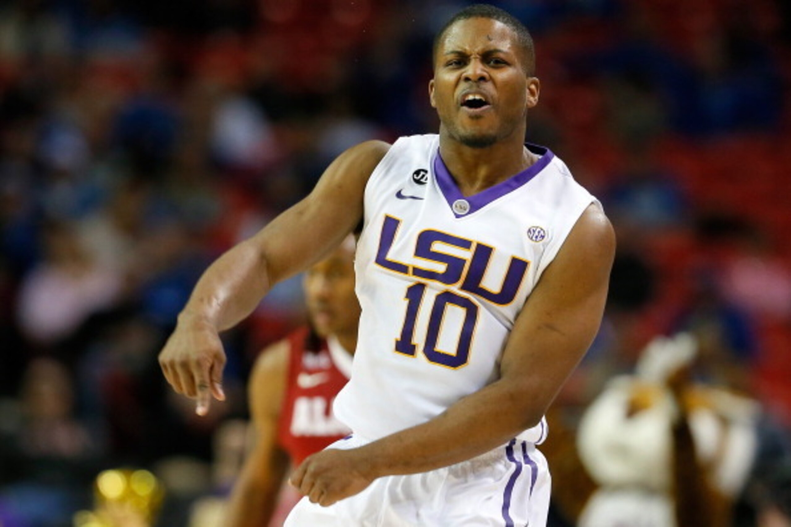 ATLANTA, GA - MARCH 13: Andre Stringer #10 of the LSU Tigers reacts after hitting a three-point basket against the Alabama Crimson Tide during the second round of the SEC Men's Basketball Tournament at Georgia Dome on March 13, 2014 in Atlanta, Georgia. ATLANTA, GA - MARCH 13: Andre Stringer #10 of the LSU Tigers reacts after hitting a three-point basket against the Alabama Crimson Tide during the second round of the SEC Men's Basketball Tournament at Georgia Dome on March 13, 2014 in Atlanta, Georgia.