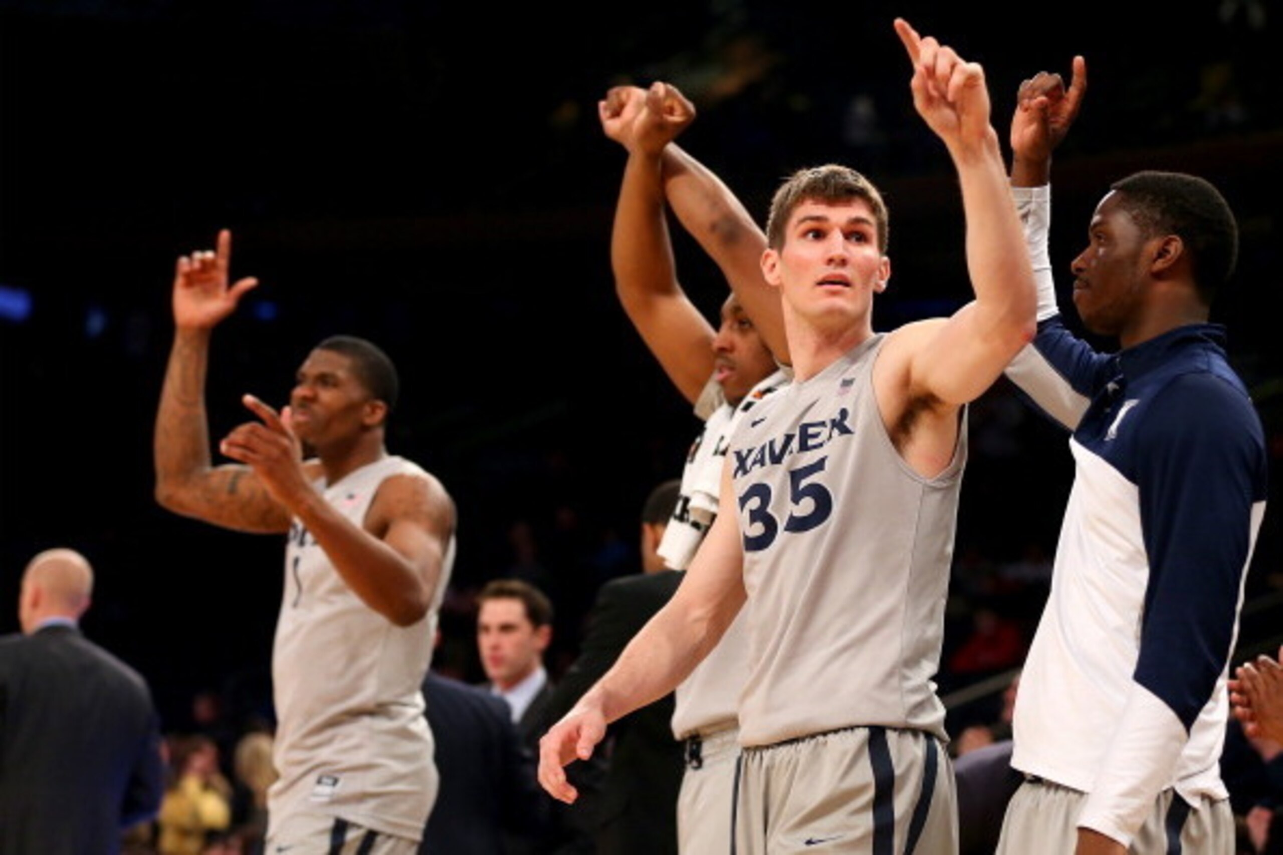 NEW YORK, NY - MARCH 13:  Erik Stenger #35 of the Xavier Musketeers celebrates the win over the Marquette Golden Eagles during the quarterfinals of the Big East Basketball Tournament at Madison Square Garden on March 13, 2014 in New York City.The Xavier M
