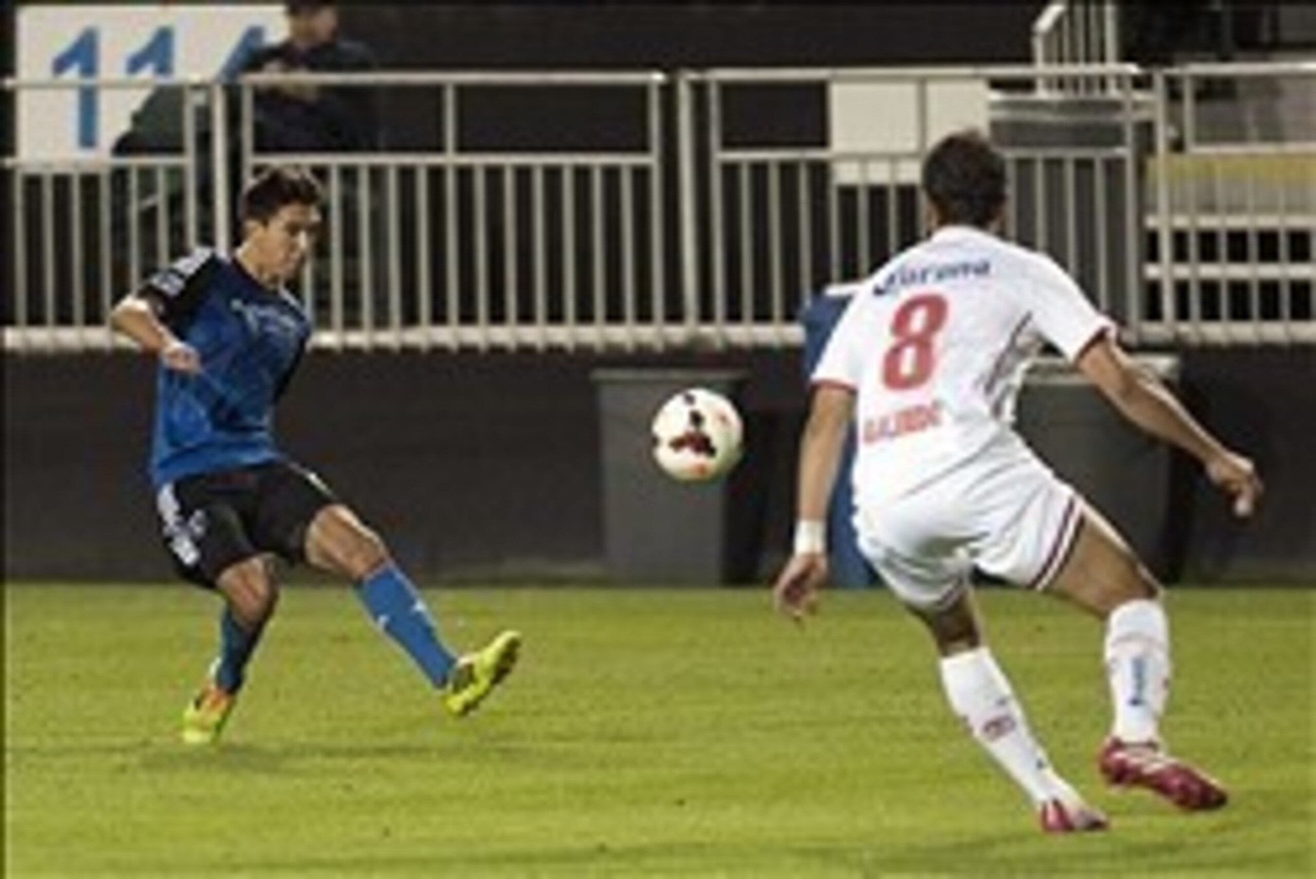 Mar 11, 2014; Santa Clara, Californial, USA; San Jose Earthquakes midfielder Shea Salinas (6) passes the ball up field past Toluca FC midfielder Diego de la Torre (8) during the second half at Buck Shaw Stadium. The San Jose Earthquakes and Toluca FC tied