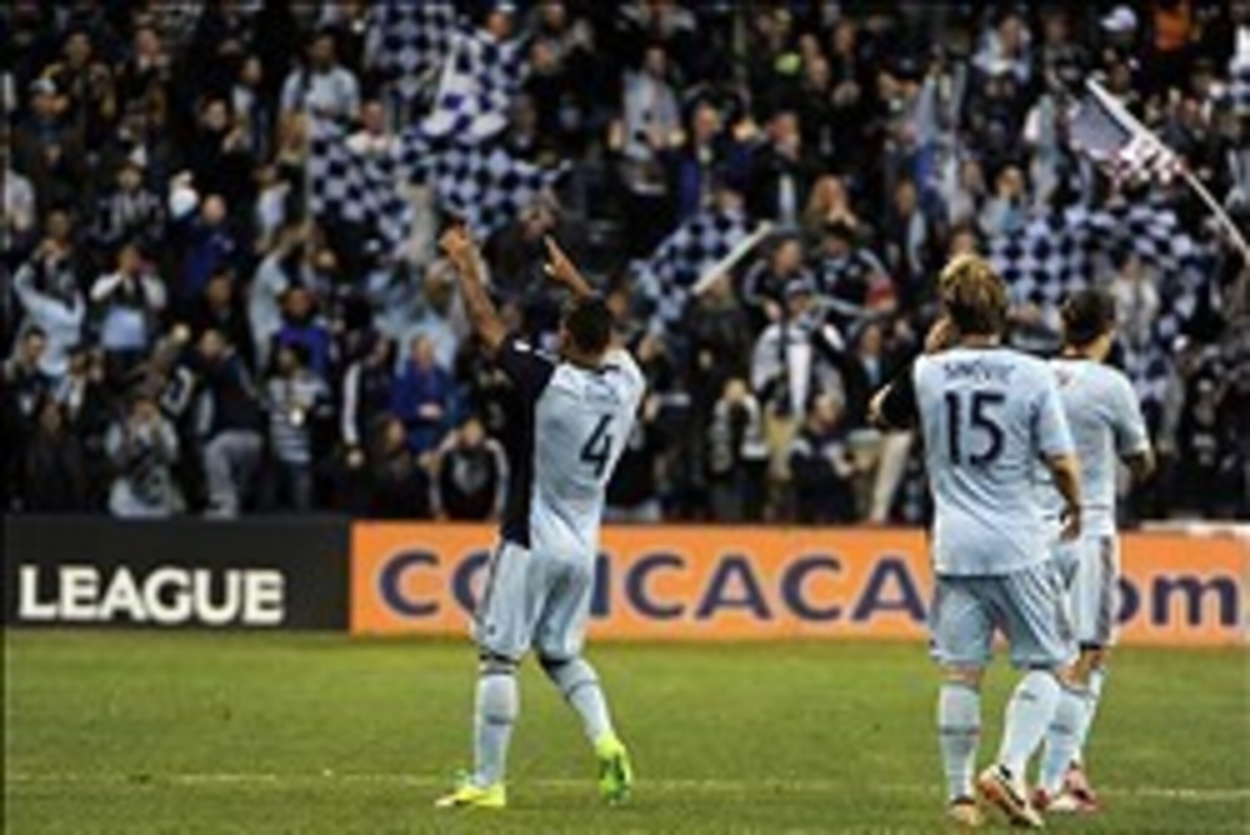 Mar 12, 2014; Kansas City, KS, USA; Sporting KC defender Kevin Ellis (4) celebrates after scoring a goal against Cruz Azul in the first half. Mandatory Credit: John Rieger-USA TODAY Sports