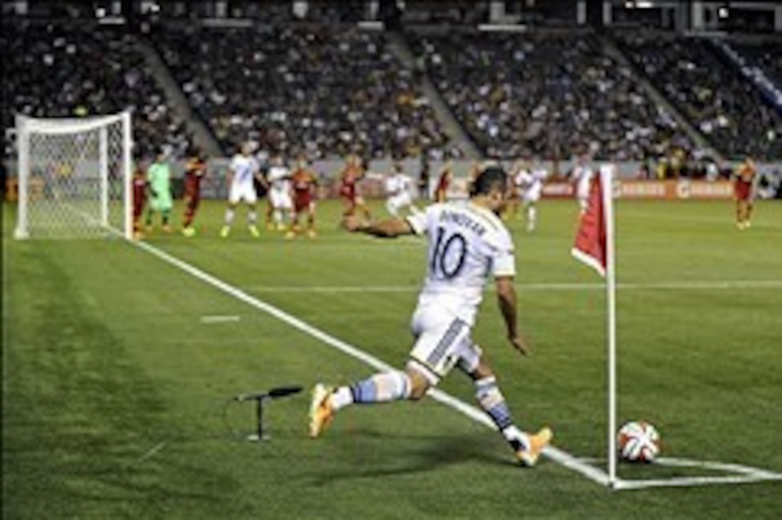 Mar 8, 2014; Carson, CA, USA; Los Angeles Galaxy midfielder Landon Donovan (10) takes a corner kick in the second half against the Real Salt Lake at StubHub Center. Real Salt Lake defeated the Los Angeles Galaxy 1-0. Mandatory Credit: Andrew Fielding-USA 