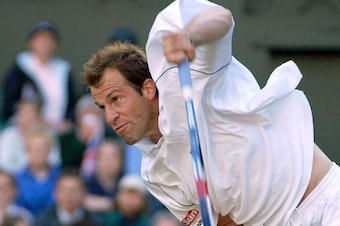 WIMBLEDON - July 1:  Greg Rusedski of Great Britain in action against Xavier Malisse of Belgium at the All England Tennis Championships at the All England Lawn Tennis Club, Wimbledon, England, on July 1, 2002. (Photo by Clive Brunskill/Getty Images)
