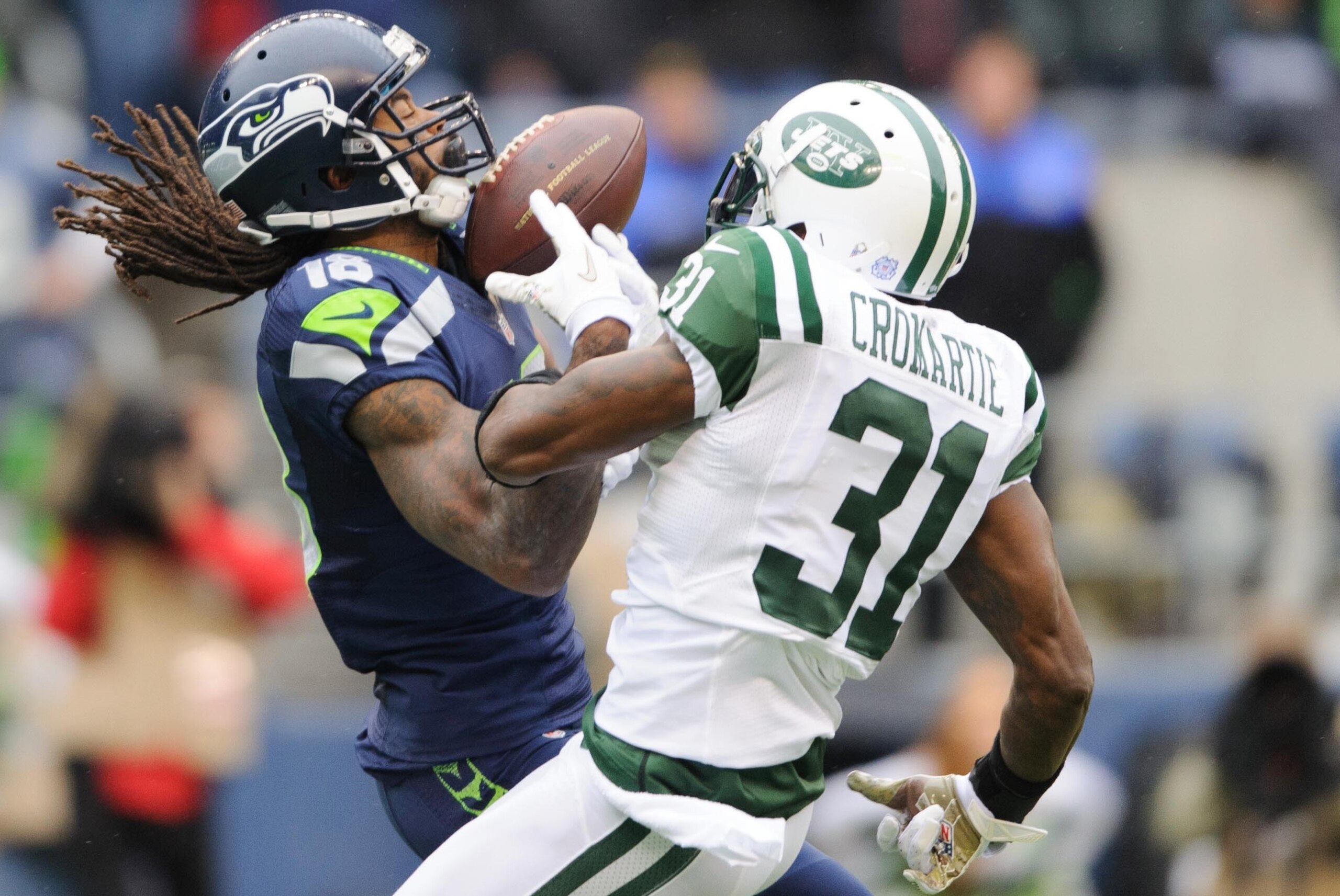 Nov 11, 2012; Seattle, WA, USA; Seattle Seahawks wide receiver Sidney Rice (18) and New York Jets cornerback Antonio Cromartie (31) both jump up for a pass during the 1st half at CenturyLink Field. Mandatory Credit: Steven Bisig-USA TODAY Sports
