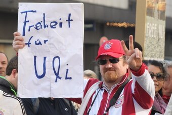MUNICH, GERMANY - MARCH 13:  A Bayern Muenchen fan holds up a banner reading 'Freedom for Uli' to support president of Bayern Muenchen Ulrich Hoeness in front of the Higher Regional Court on March 13, 2014 in Munich, Germany. President of Bayern Muenchen 