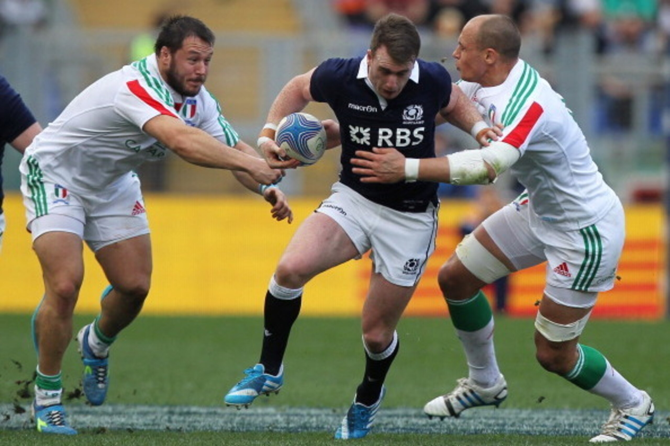 ROME, ITALY - FEBRUARY 22: Stuart Hogg of Scotland is tackled by Leonardo Ghiraldini and Sergio Parisse of Italy during the RBS Six Nations match between Italy and Scotland at Stadio Olimpico on February 22, 2014 in Rome, Italy. (Photo by Paolo Bruno/Ge ROME, ITALY - FEBRUARY 22: Stuart Hogg of Scotland is tackled by Leonardo Ghiraldini and Sergio Parisse of Italy during the RBS Six Nations match between Italy and Scotland at Stadio Olimpico on February 22, 2014 in Rome, Italy. (Photo by Paolo Bruno/Ge