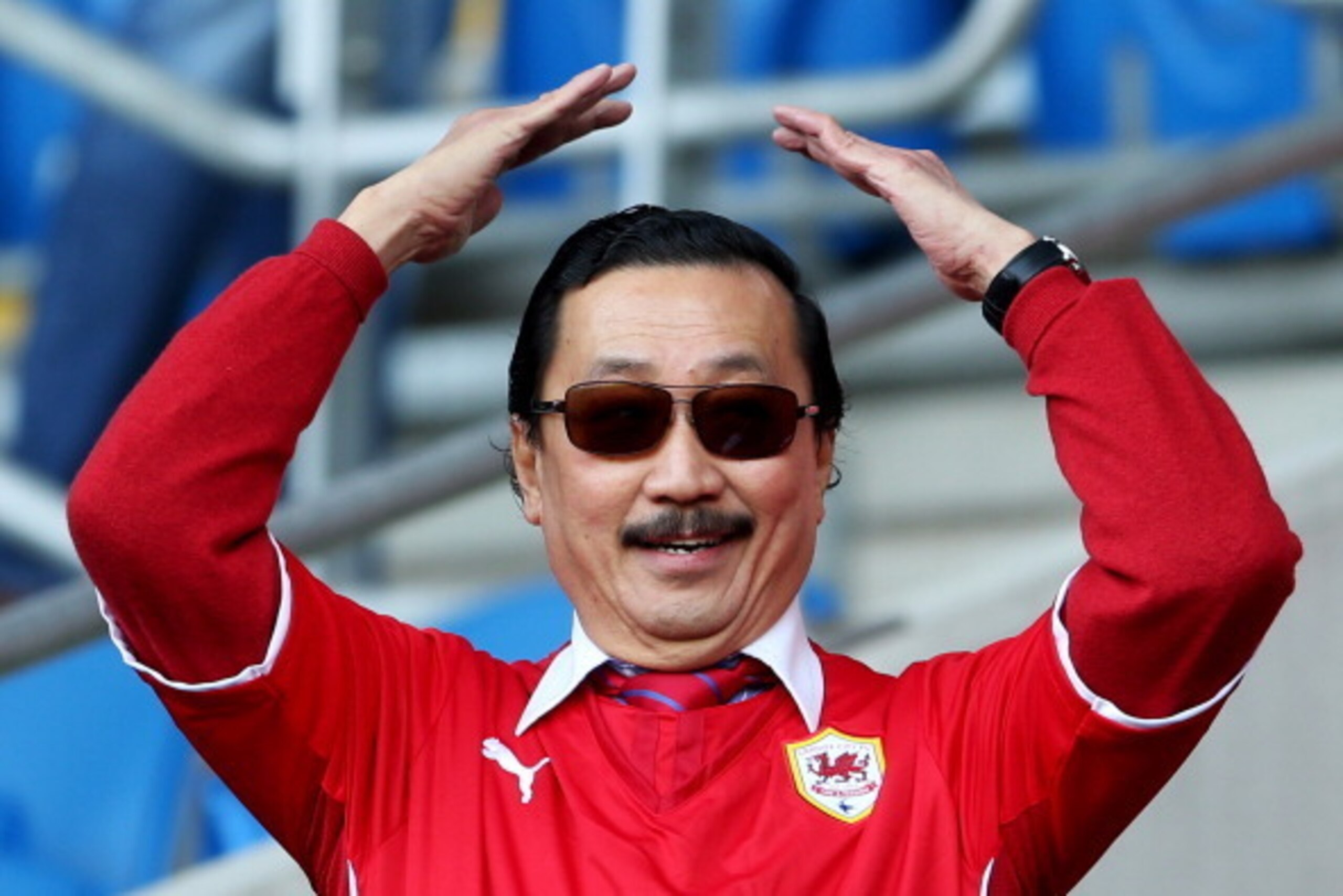 CARDIFF, WALES - MARCH 08:  Cardiff City owner Vincent Tan looks on prior to the Barclays Premier League match between Cardiff City and Fulham at Cardiff City Stadium on March 8, 2014 in Cardiff, Wales.  (Photo by Scott Heavey/Getty Images)